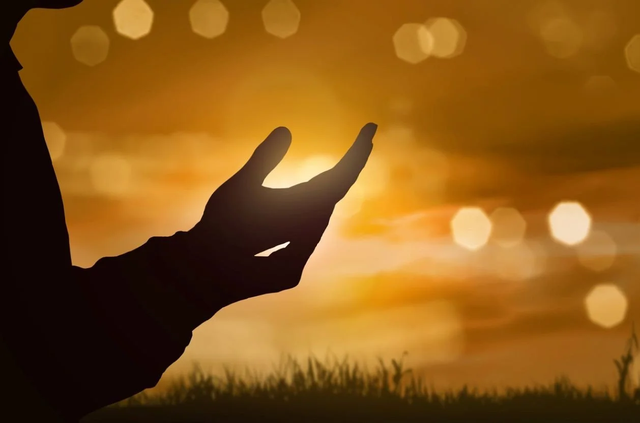 Hands Lifted in Prayer