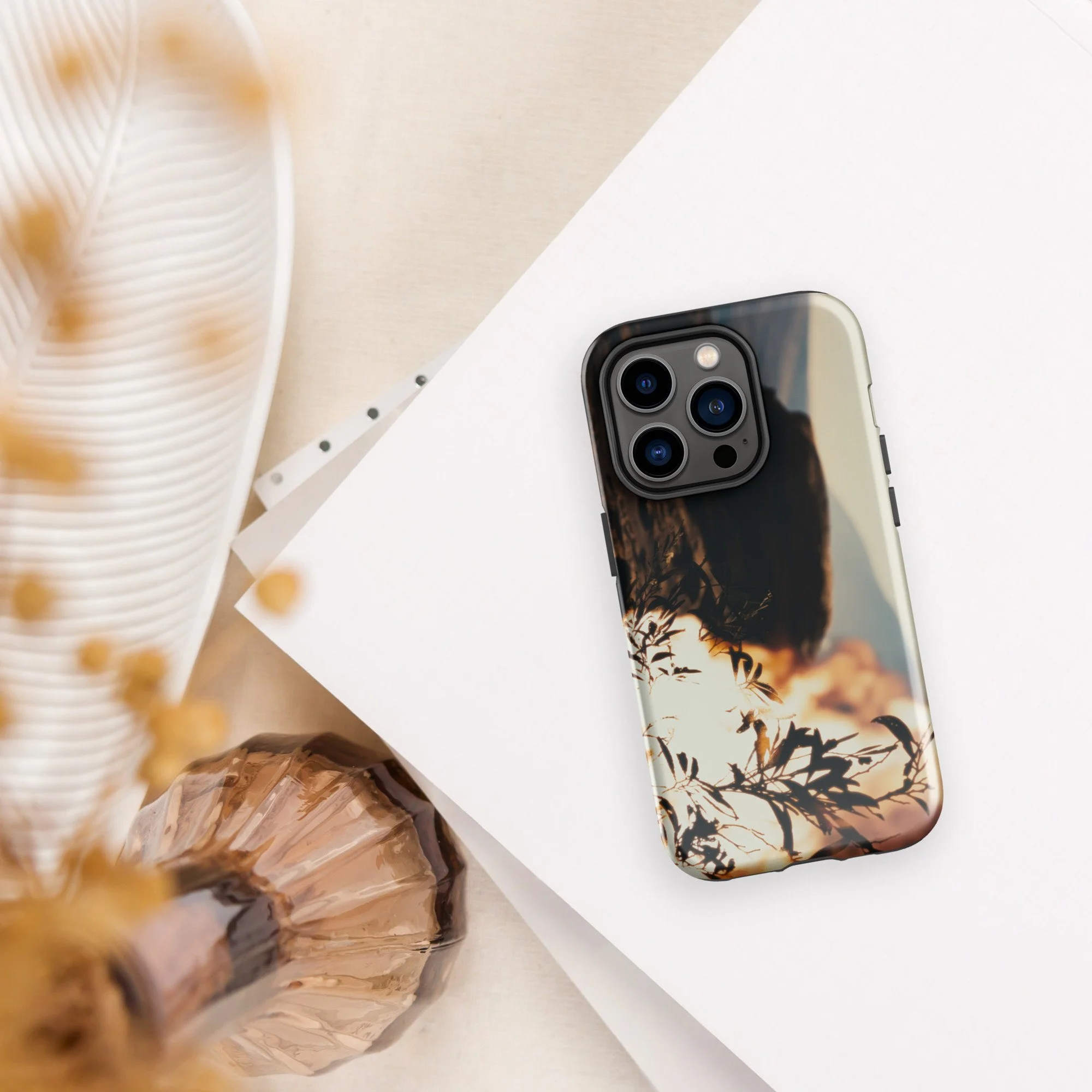 Back camera angle view of fiery Burning Bush artwork on a sleek iPhone case