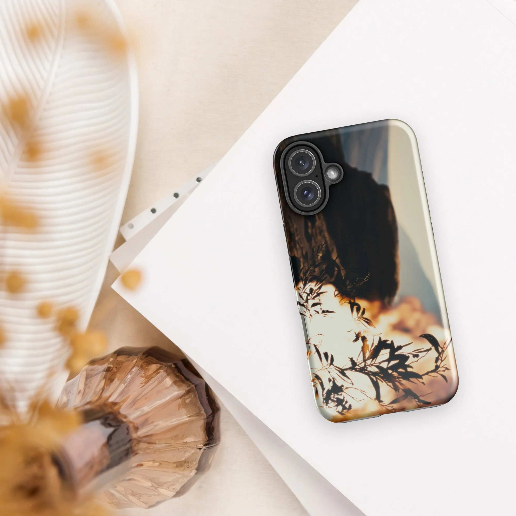 Back camera angle view of fiery Burning Bush artwork on a sleek iPhone case