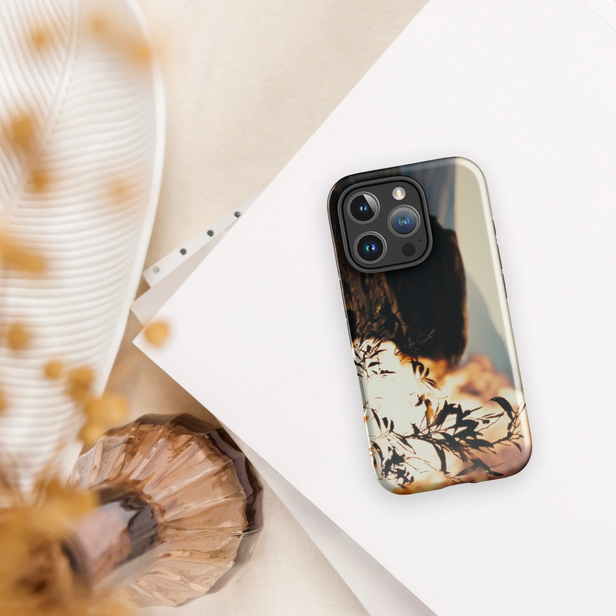 Back camera angle view of fiery Burning Bush artwork on a sleek iPhone case