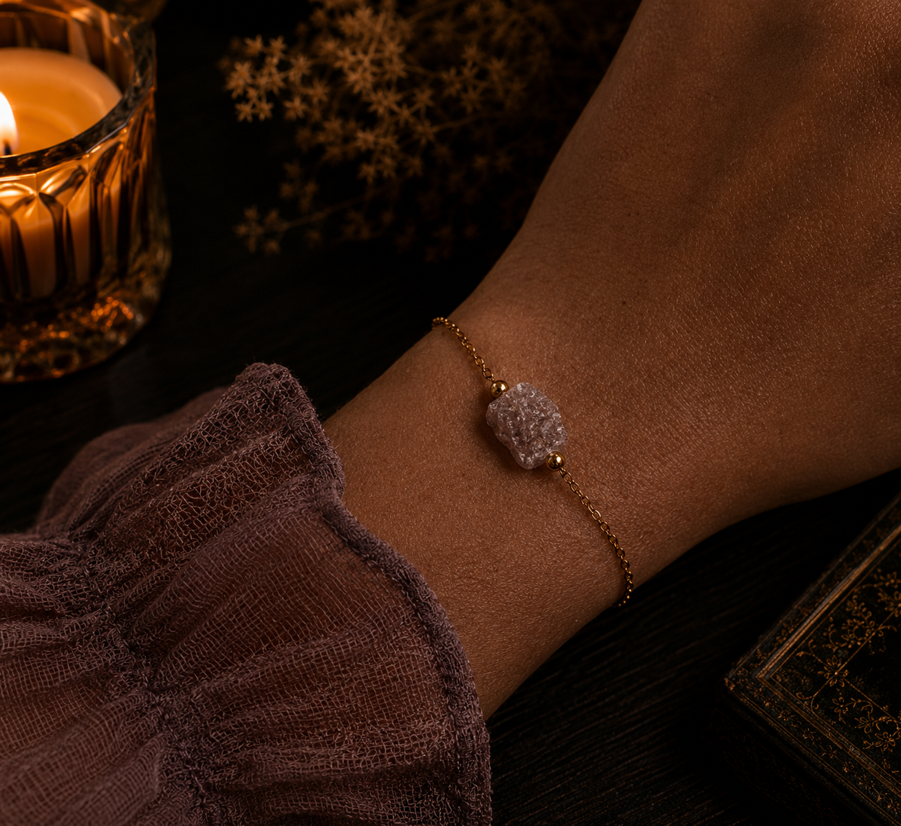 Luxurious jewelry display with warm ambiance strawberry quartz bracelet raw crystal (2).png