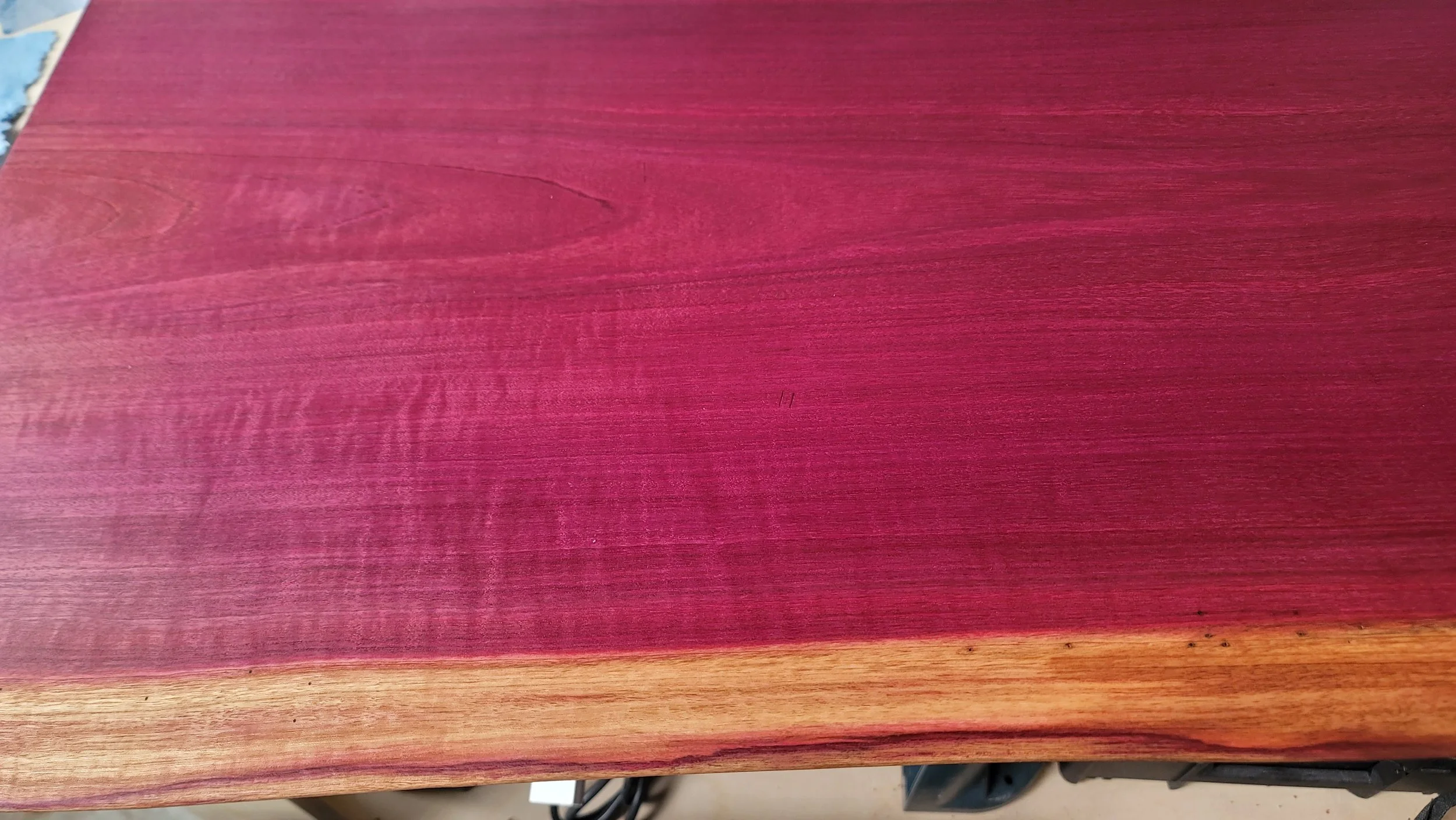 The natural linseed oil finish accentuates the rippled figure in the wood. Notice the bug holes along the sapwood edge. A fairly common condition, it reminds us that the wood was once alive and a part of the food chain. All furniture wood is kiln dri