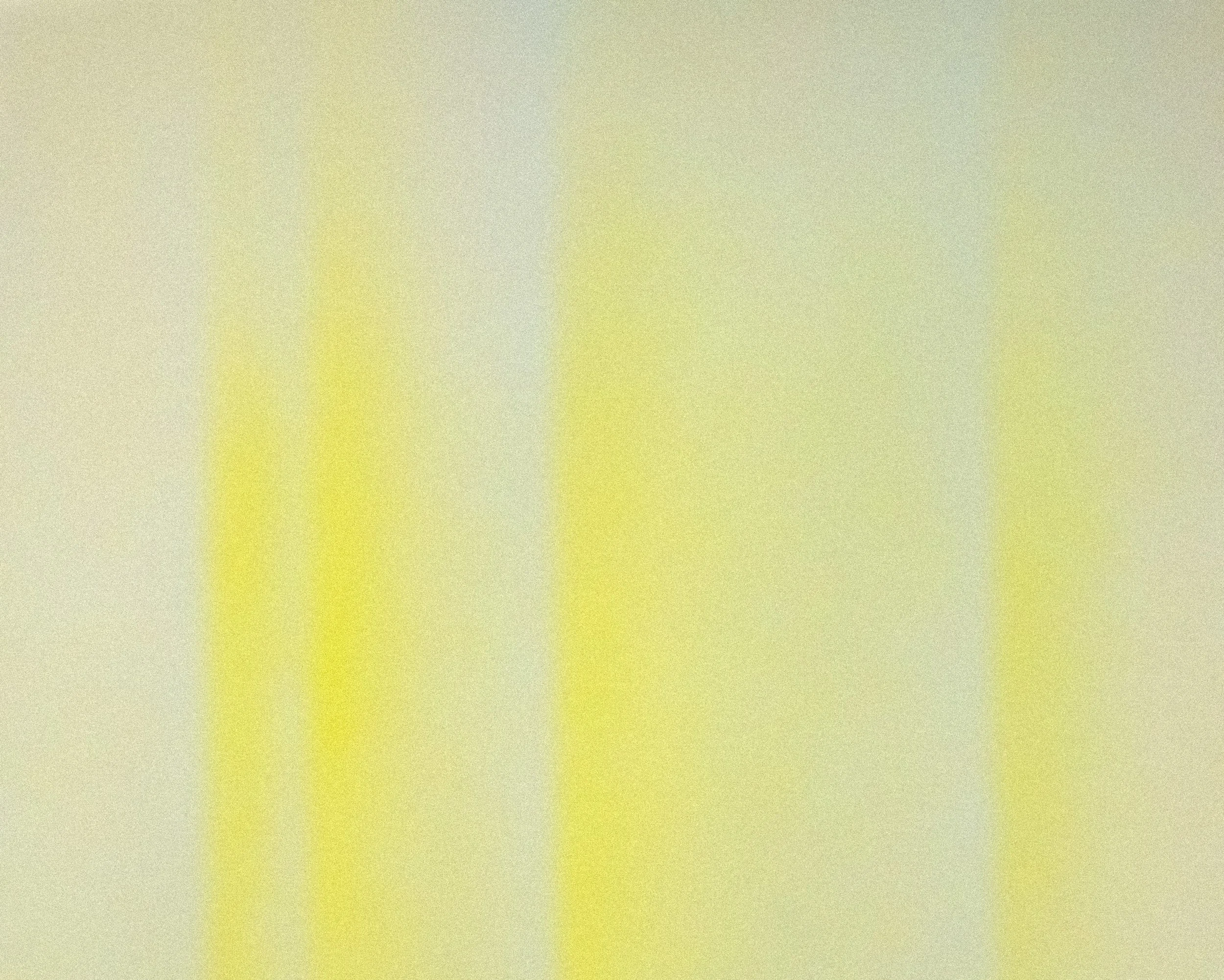 Blurred abstract background with yellow and beige tones.