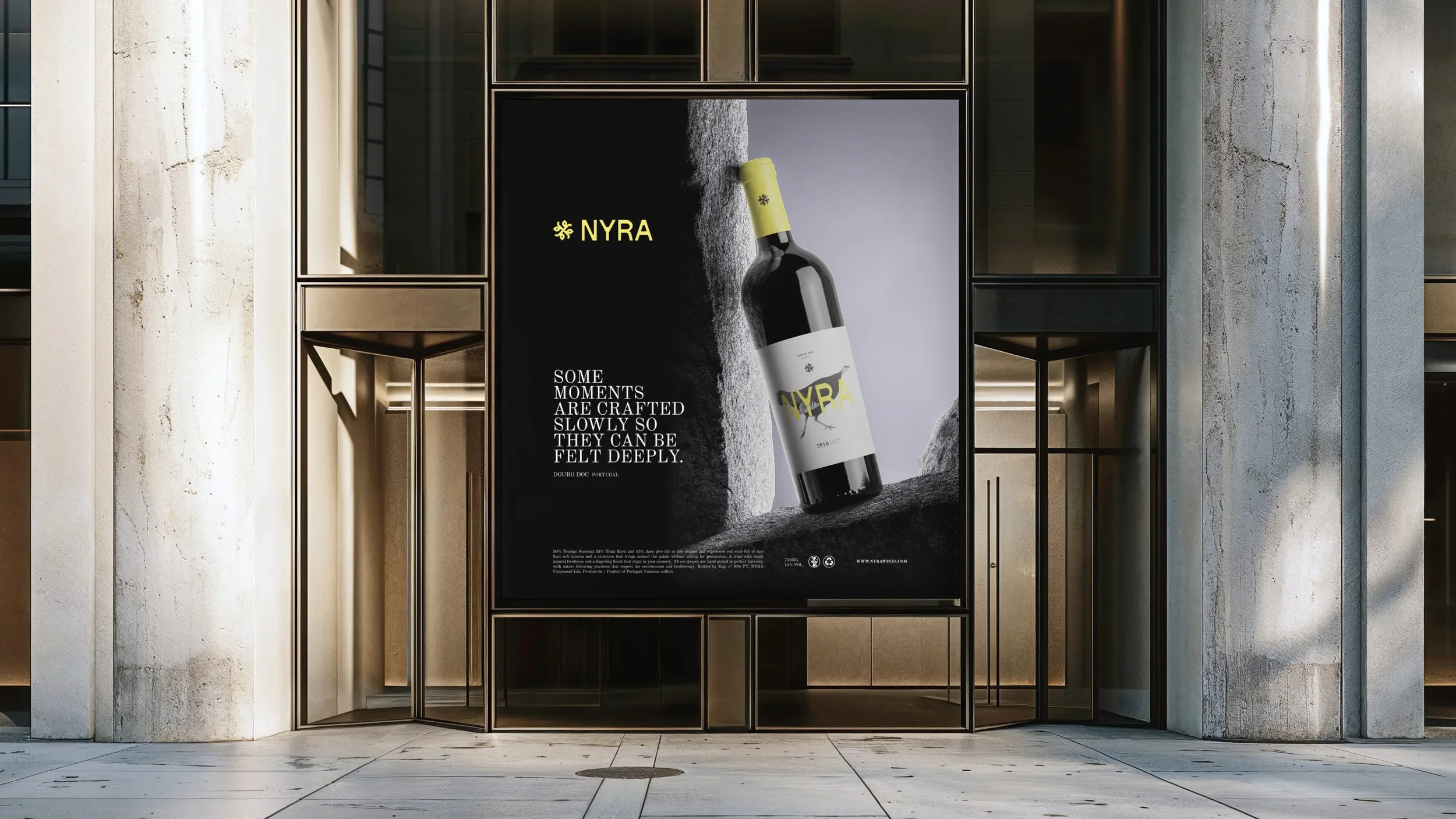 Advertisement poster for NYRA wine featuring a tilted wine bottle on rocky terrain with the tagline: 'Some moments are crafted slowly so they can be felt deeply.' The background is a combination of black, white, and gray textures.
