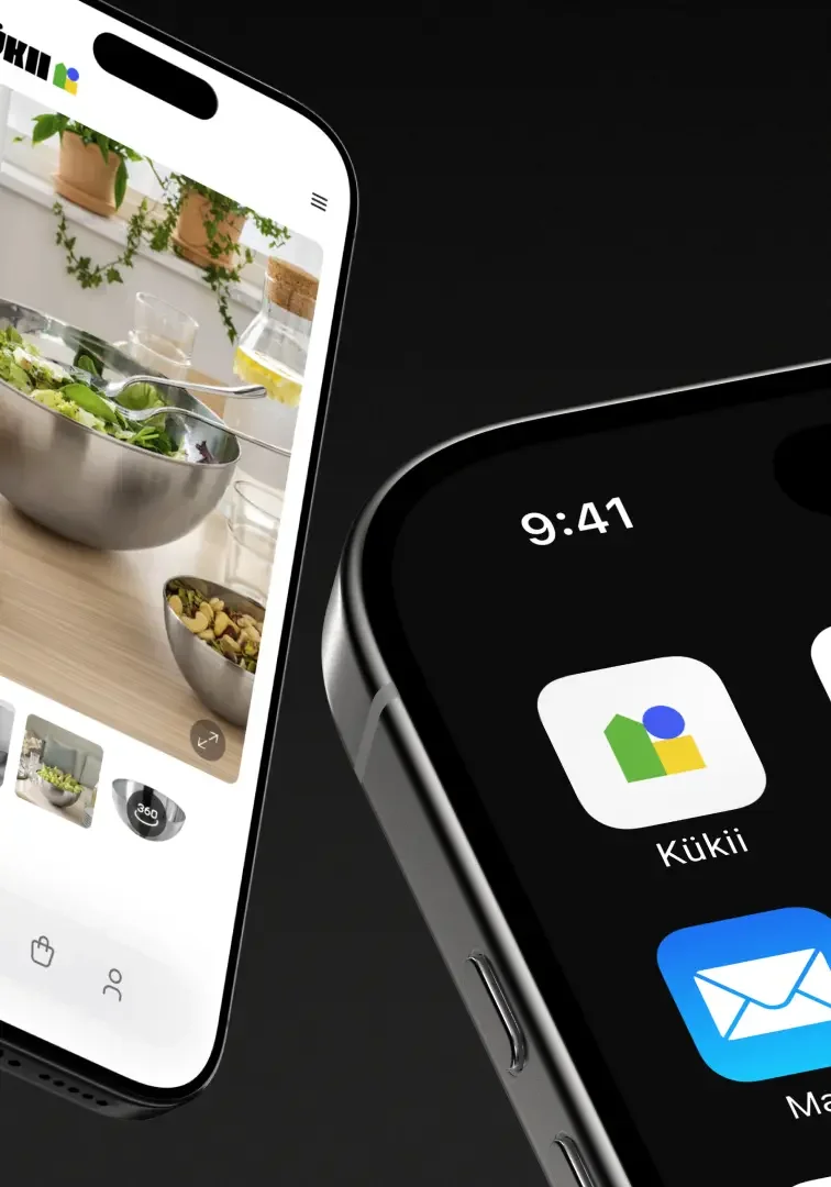 Close-up of two smartphones displaying app screens. One phone shows a food or salad preparation app with a picture of bowls of salad and kitchen items in the background. The other phone displays the time 9:41 and app icons for Kūkī and Mail.