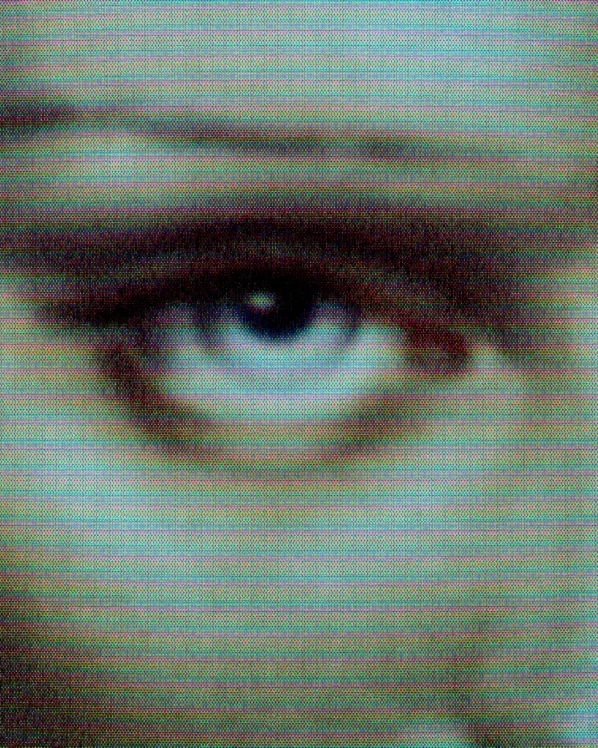 Close-up of a person's eye with visible eye makeup and light skin, with digital noise and horizontal lines across the image.