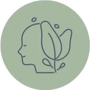 Line art illustration of a human face profile with a leaf, symbolizing eco-conscious or natural skincare, on a green circular background.