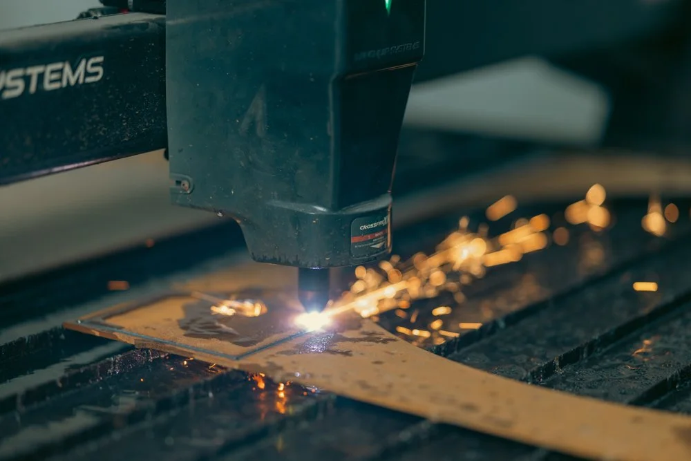 Sparks from a plasma cutter at Atlas Machine Works, photographed by JAWFOX Productions.
