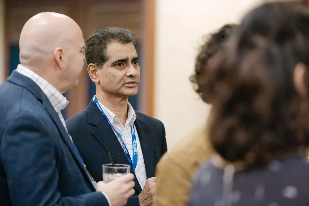 Guests in conversation at a Bon Secours event photographed by JAWFOX Productions.