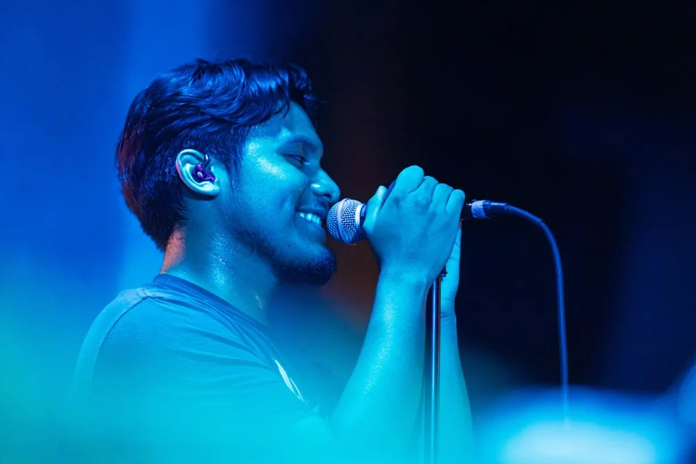 235 Ways vocalist performing under blue stage lighting, photographed by JAWFOX Productions.