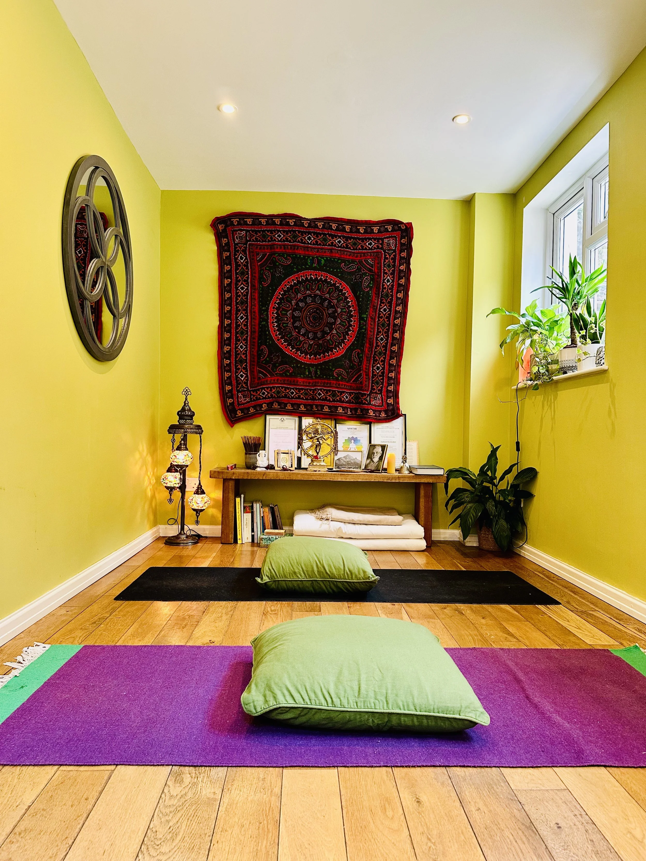 Shabnam Yoga peaceful studio in Pembrokeshire UK with mats, cushions, altar, and natural light Founded by Shabnam Banihashem