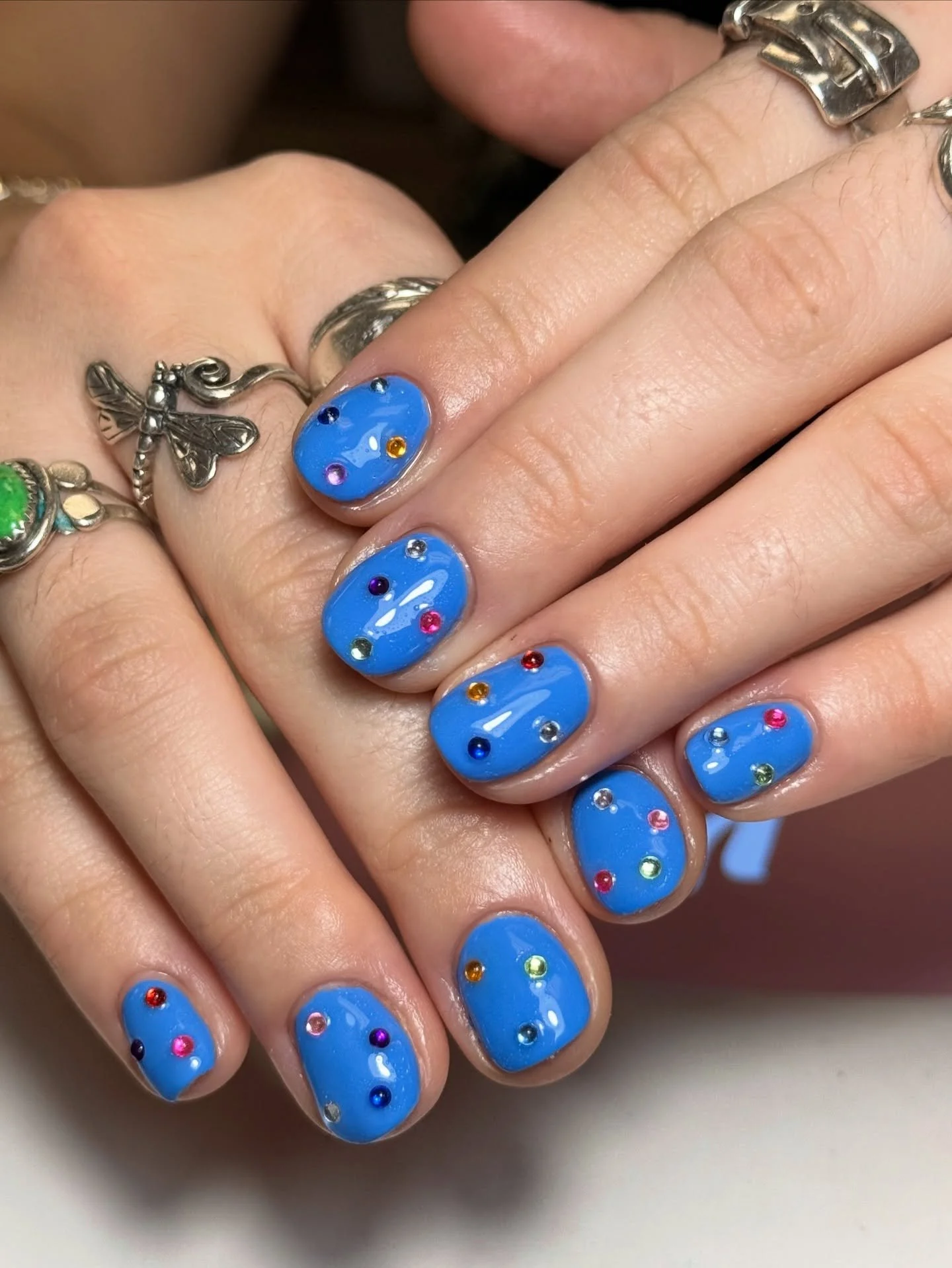 Blue bejeweled builder mani by @tlynnes_nails