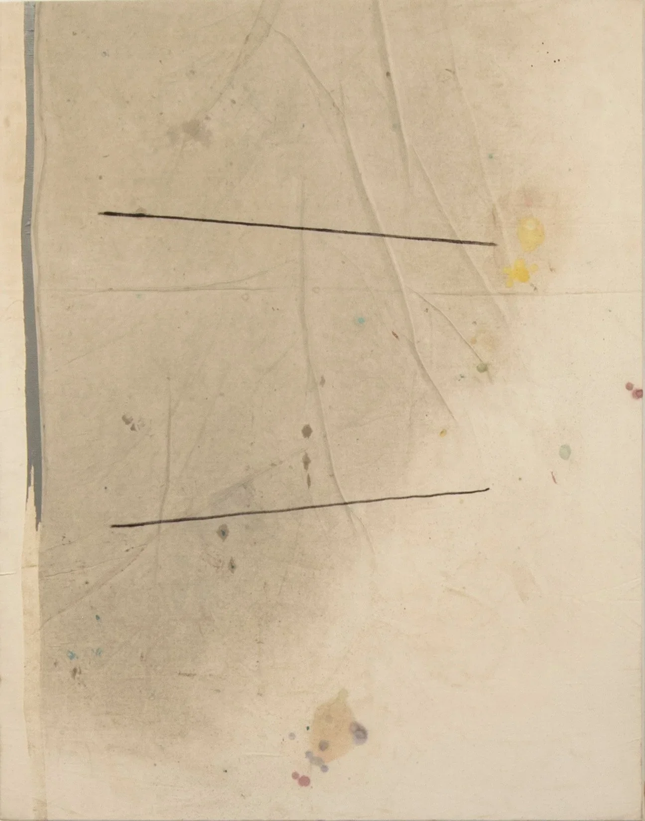 A piece of paper with two horizontal black lines drawn on it, with faint smudges and colorful ink splatters in the background.