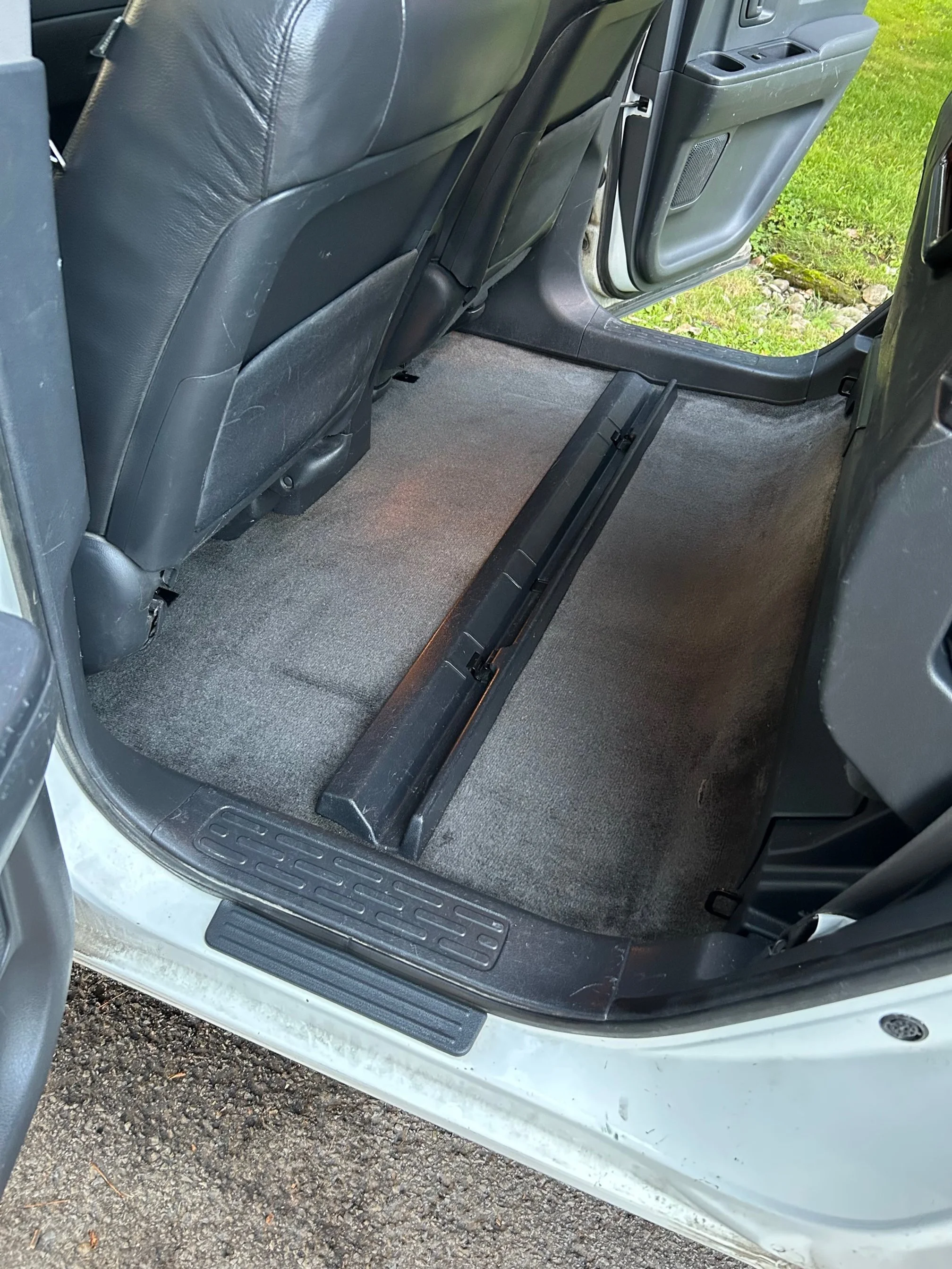 Dirty back seat with wood/sand - After