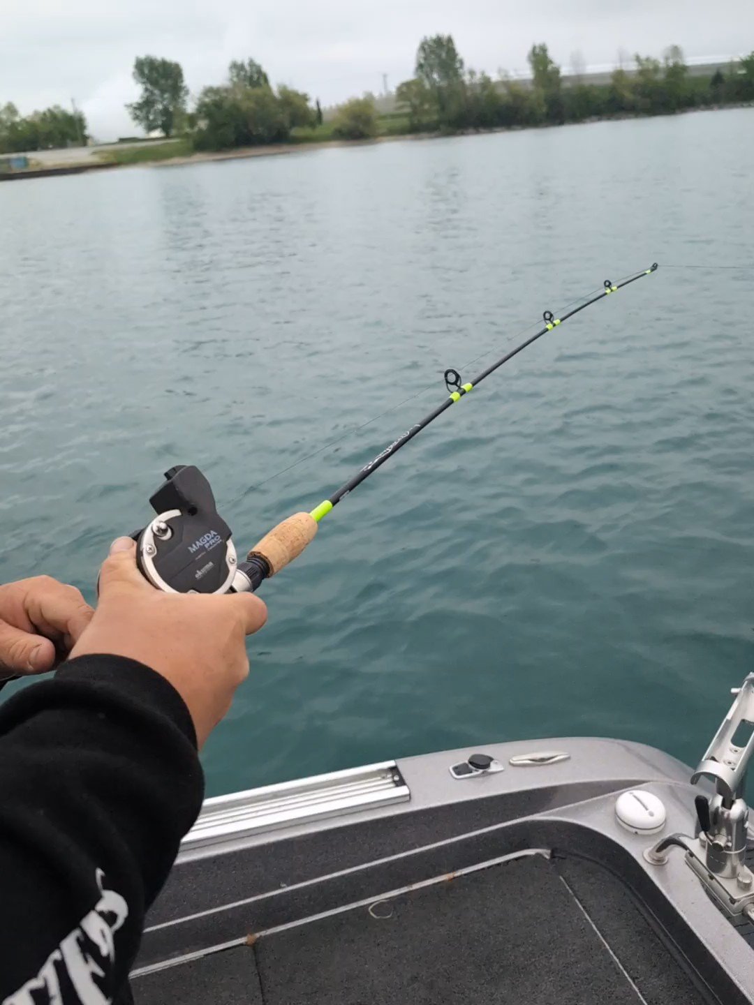 Short whipping rod and line-counter reel setup for river walleye fishing on Big Chubs Charter Co.