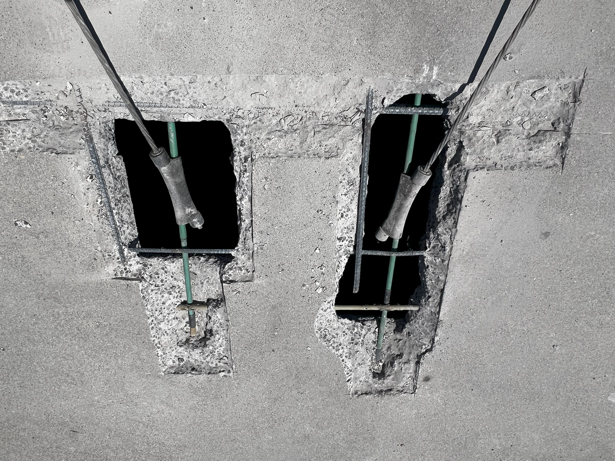 Post tension anchorage pockets cleaned and prepared for epoxy coating and restoration with high strength non shrink grout.