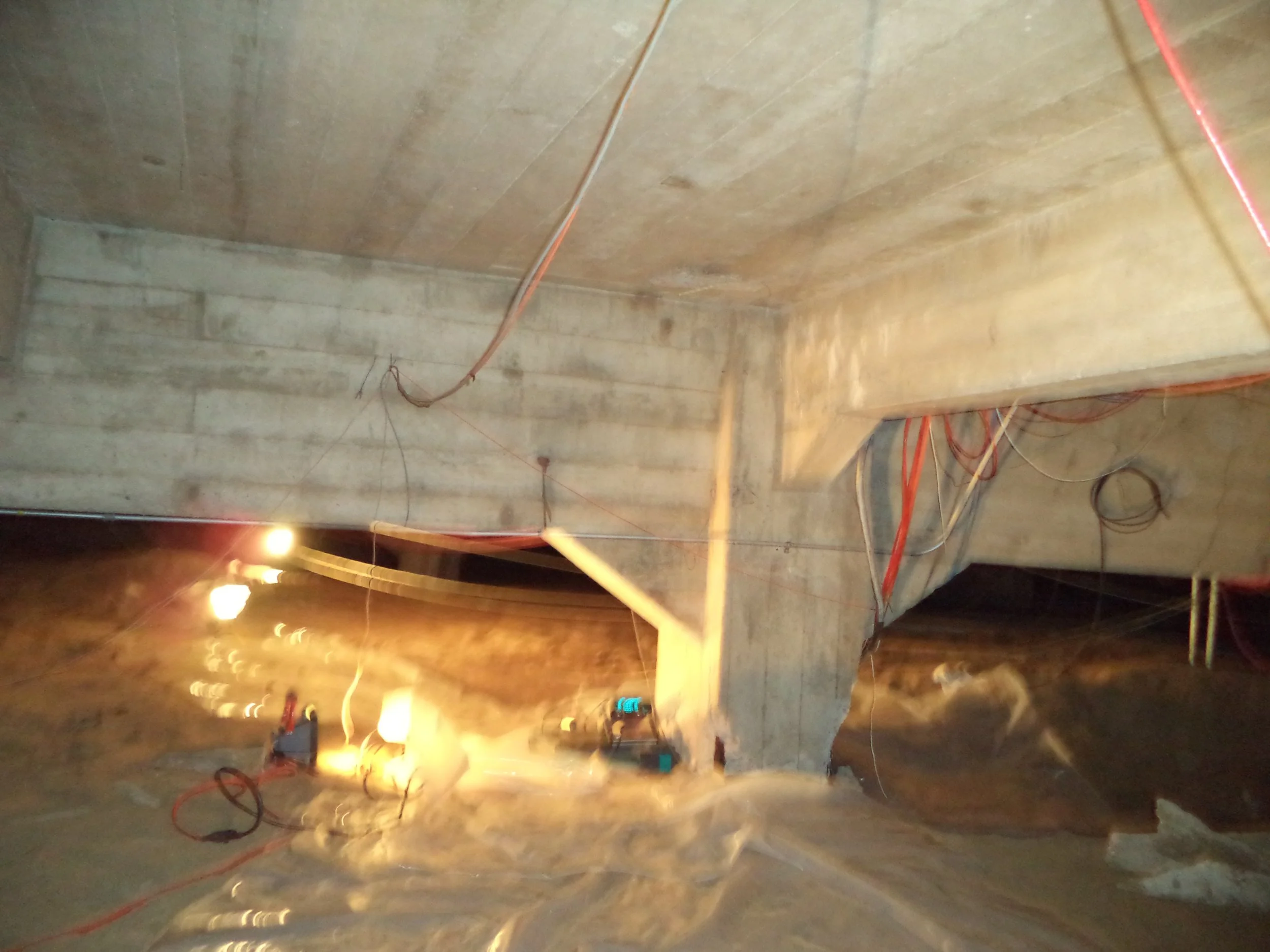 Basement Concrete Structure with Temporary Lighting Setup