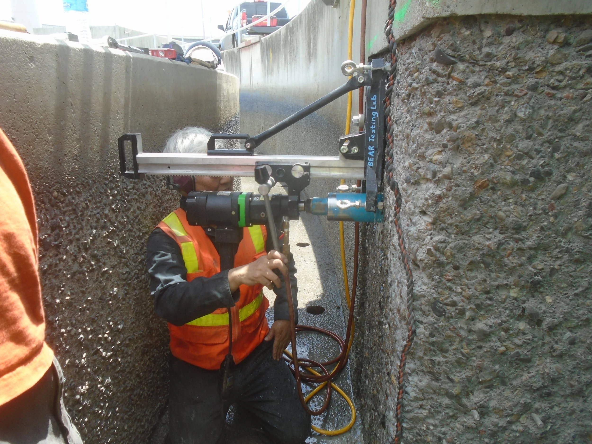technician-performs-pull-off-test-ebmud-wall-surface