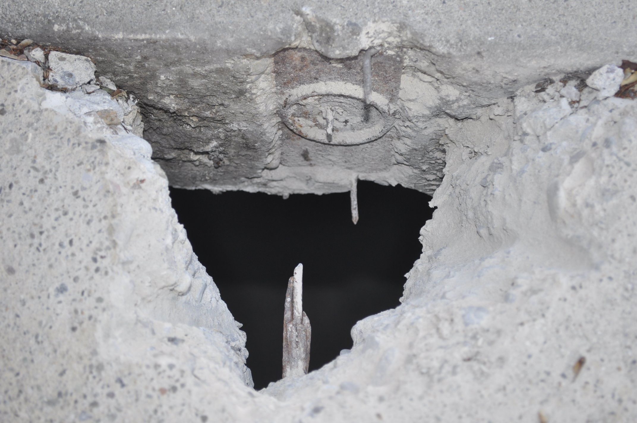 Concrete breakout exposing tendon anchorage