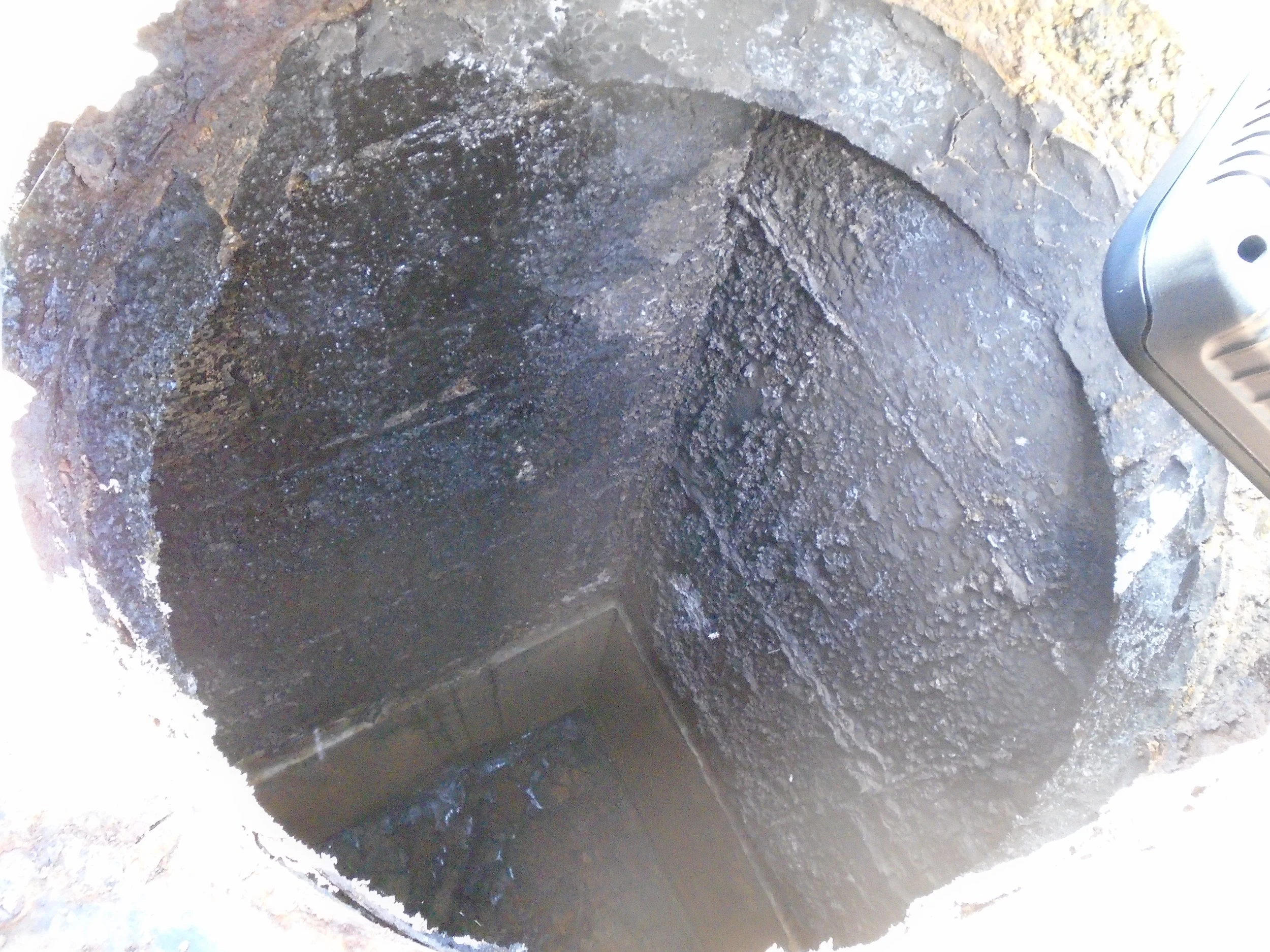 Interior view through an access hatch into the Vacuator, showing the confined entry point used for inspection and maintenance access.
