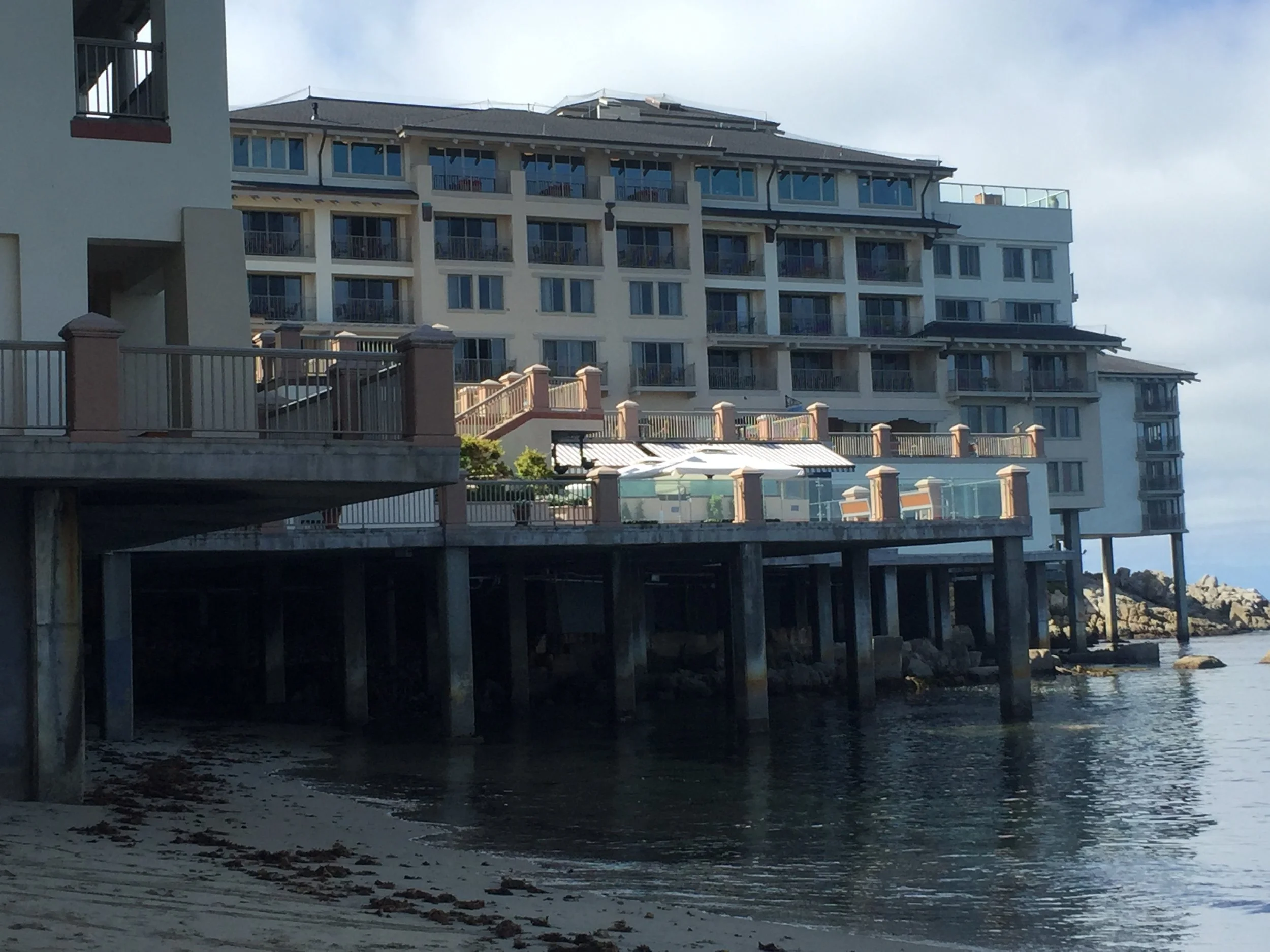Historic coastal hotel required an in-depth structural assessment of its reinforced concrete plaza-level slab due to visible distresses
