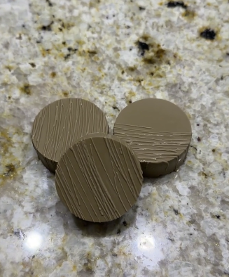 Tan textured chocolate-covered Oreo cookies