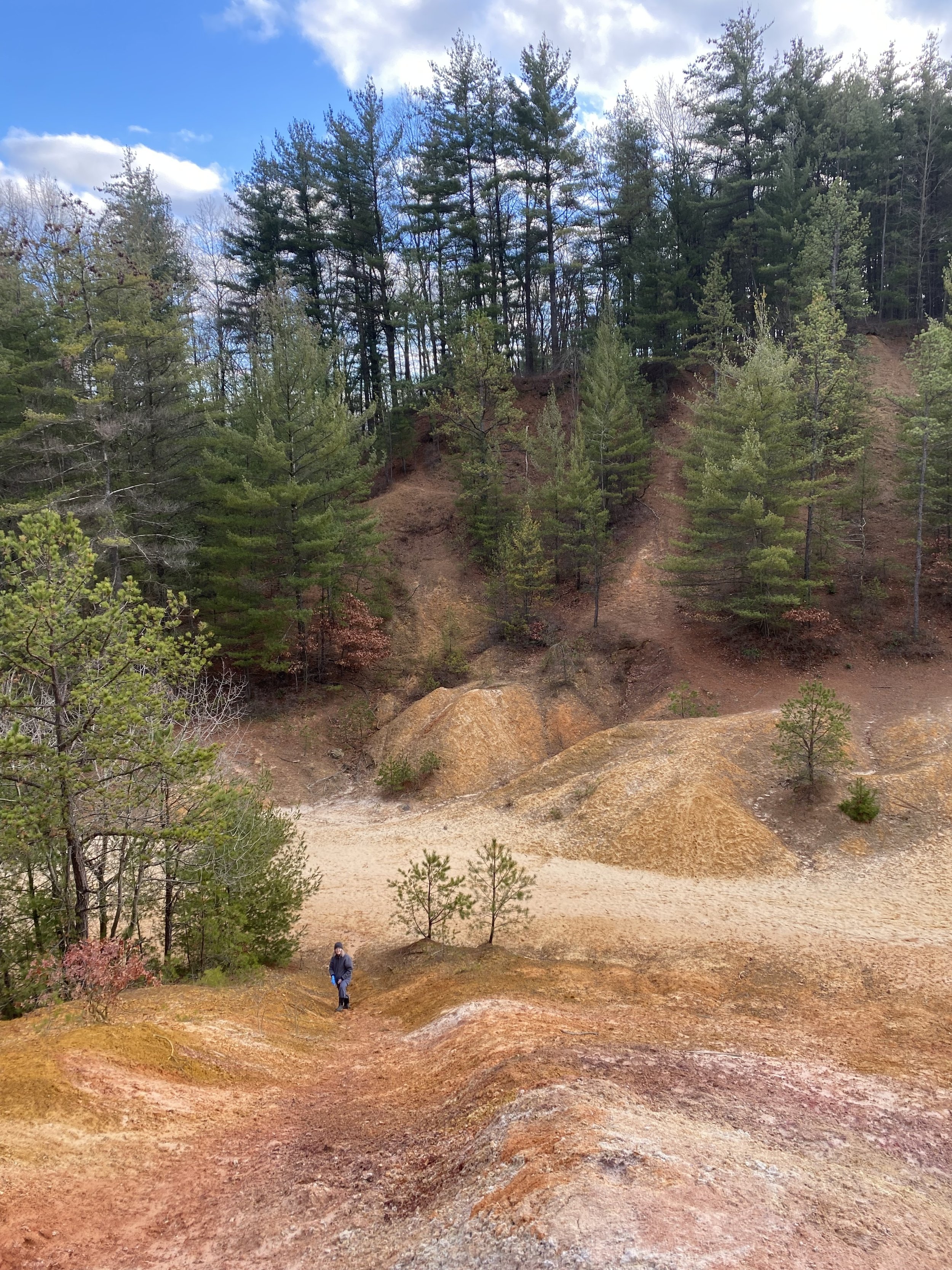 Artist in carved out/abandoned porcelain clay mine (Centre Co., Pennsylvania) - 2024.