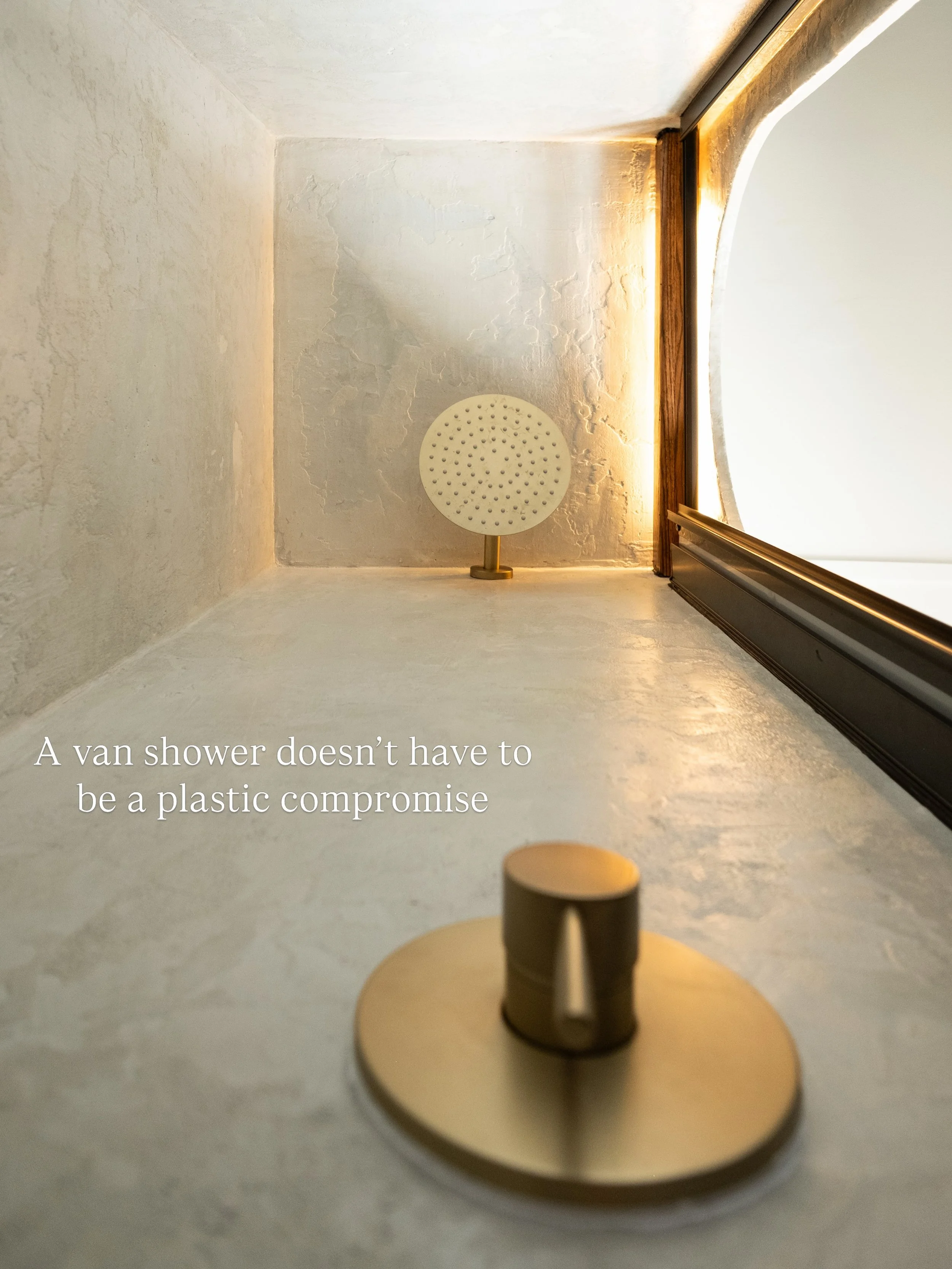Really proud of how this van shower turned out.

Finished with microcement walls and floor, a Nautilus shower door, and a custom oak light fixture to tie it all together👏

Built by @carly_wesolowski at Cedar &amp; Steel.

#vanshower #microcement #cu