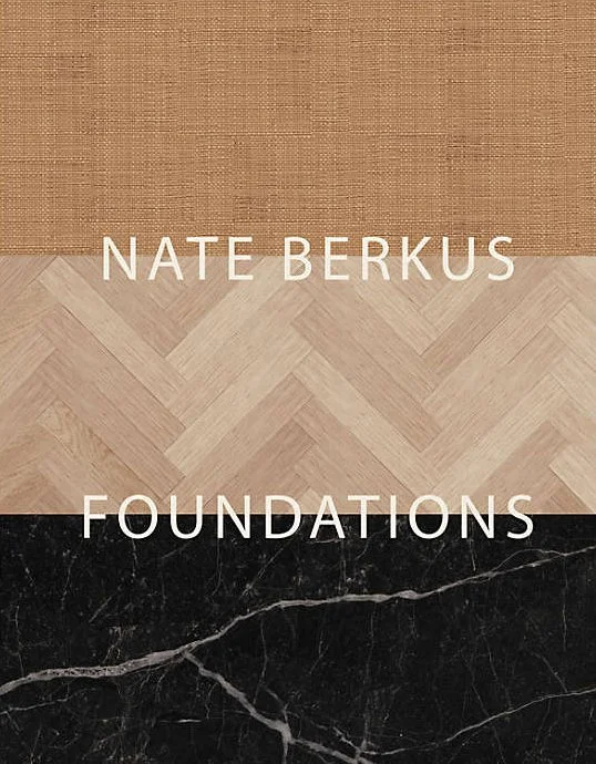 Book cover titled 'Nate Berkus Foundations' with color blocks of brown, beige, and black marble.