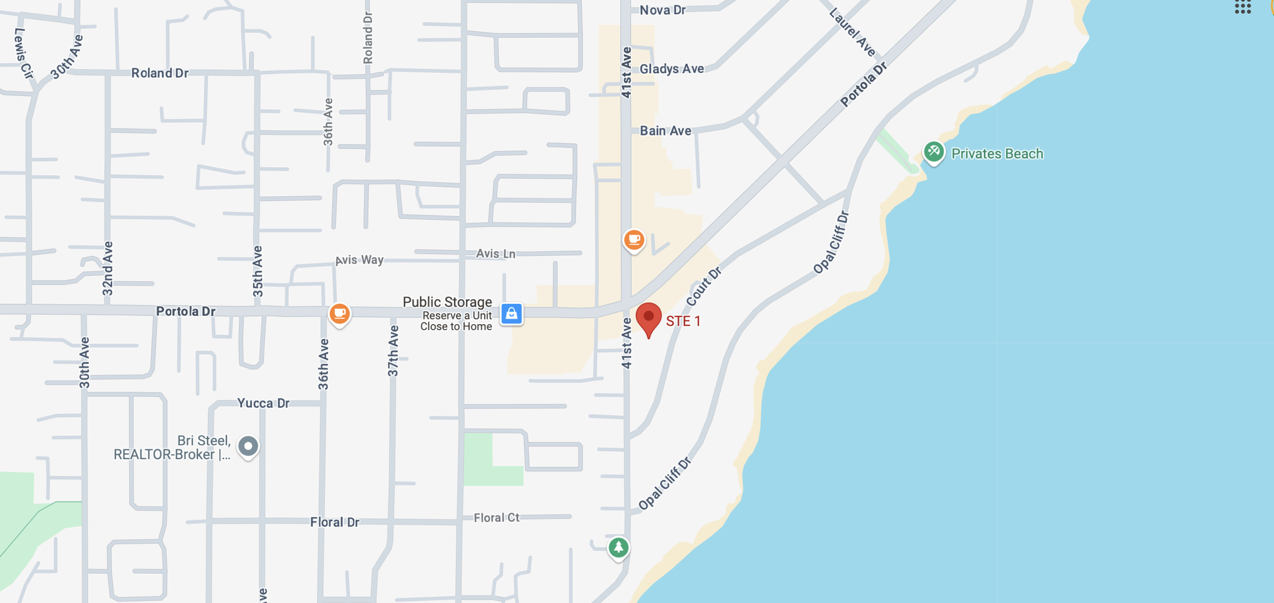 Map showing streets near the coast with markers for a beach, stores, and a 'STE 1' location along 41st Ave.