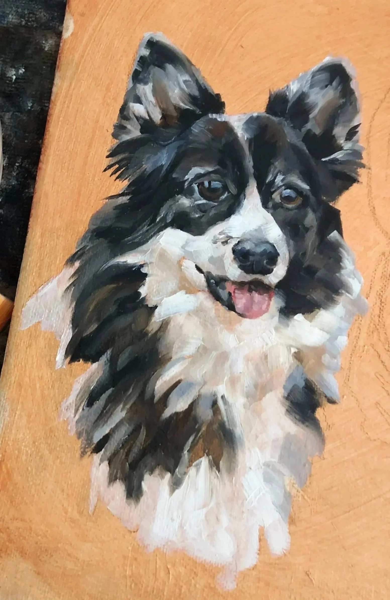 A painted portrait of a corgi dog with black, white, and tan fur, looking happy with an open mouth and tongue slightly out, on a primed canvas surface.