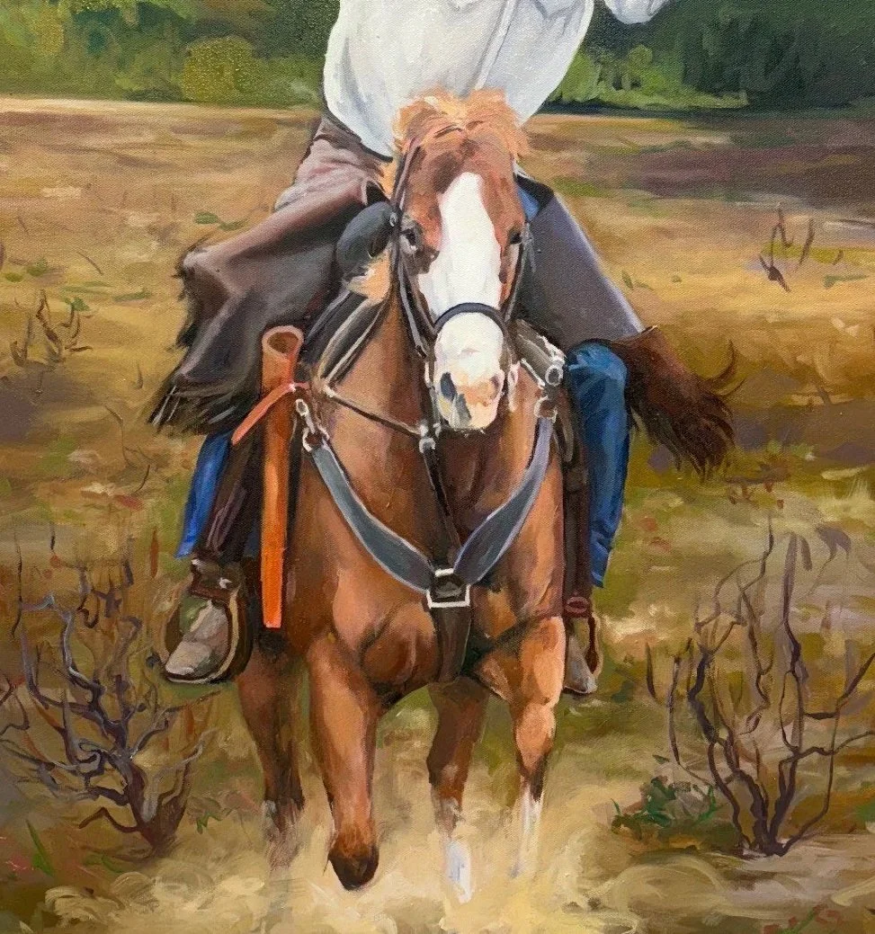 A man riding a brown and white horse in a field with sparse bushes and trees in the background. Western vintage inspired painting