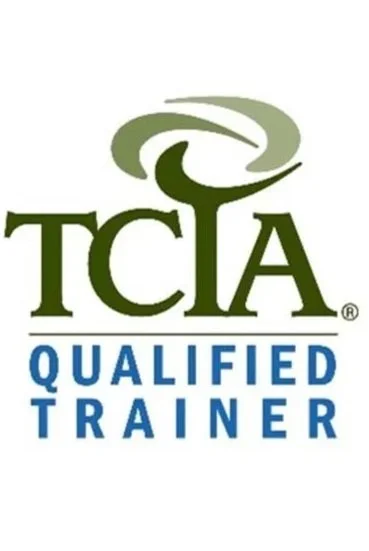 TCIA Qualified Trainer logo with a stylized green and white graphic above the text.