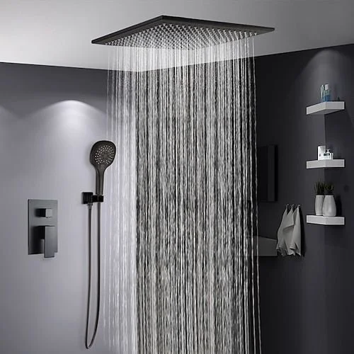 Modern shower with rainfall showerhead and handheld shower on dark and light gray tiled walls.