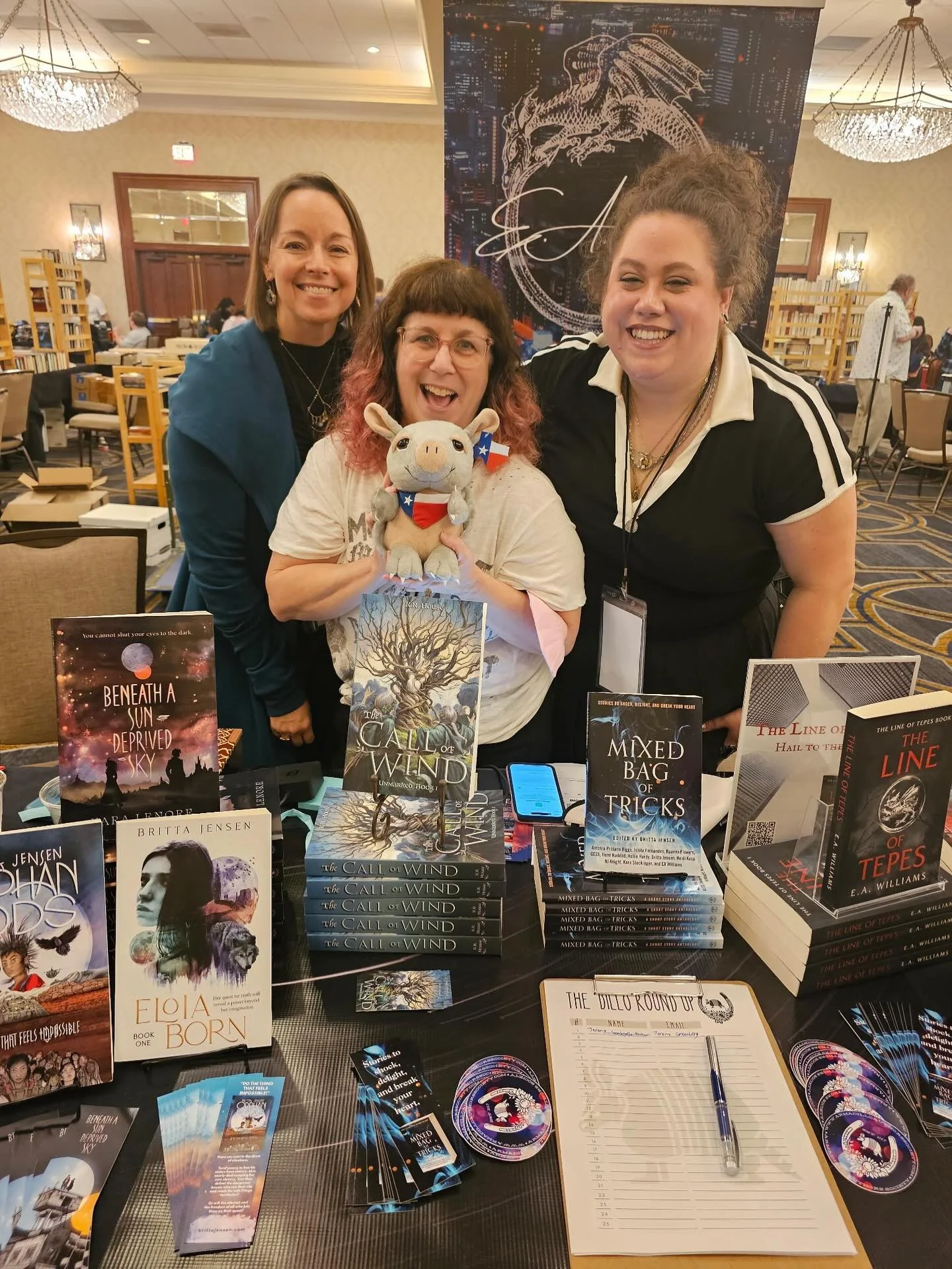 Some armadillo authors and our books @armadilloconsff as taken by one of our booth neighbors who just so happened to have a stuffy of an armadillo! @kara.lenore @e.a.williamsbooks @roannawrites