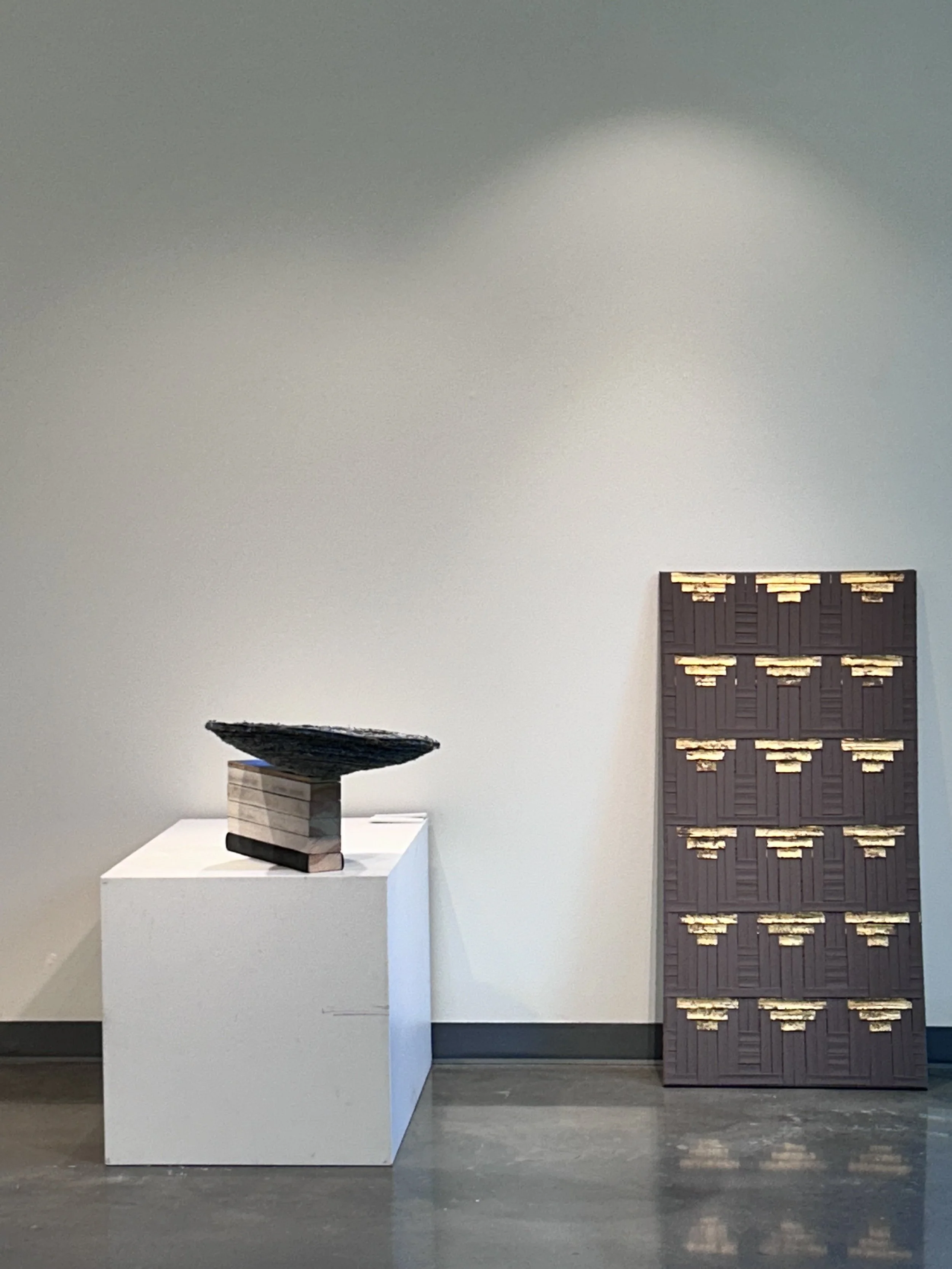 East wall:
Origins of my universe.
Hand-stitched denim bowl on pine, rubber and plywood.
20 in x 14 in x 27 in; 2021. Fayoum.
Faux gold, polyester bandages on wood frame.
48 in x 24 in; 2020.