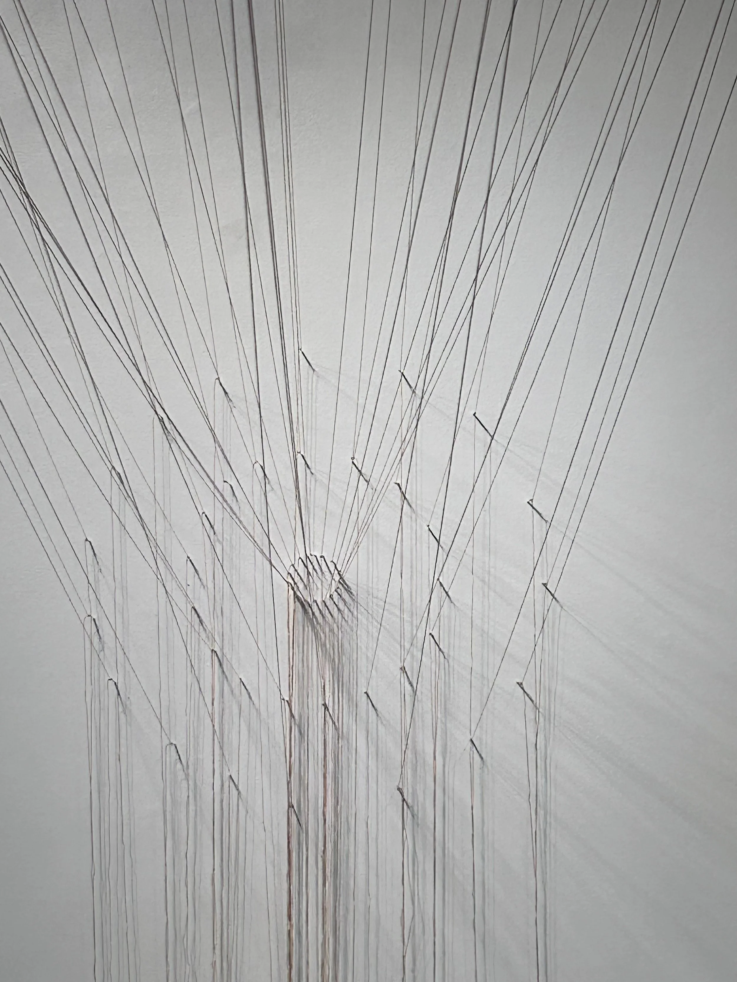 Fat moon, suspent (south wall). Denim, needles, kite string. 23 ft x 4 ft x 12 ft (site specific installation); 2024.