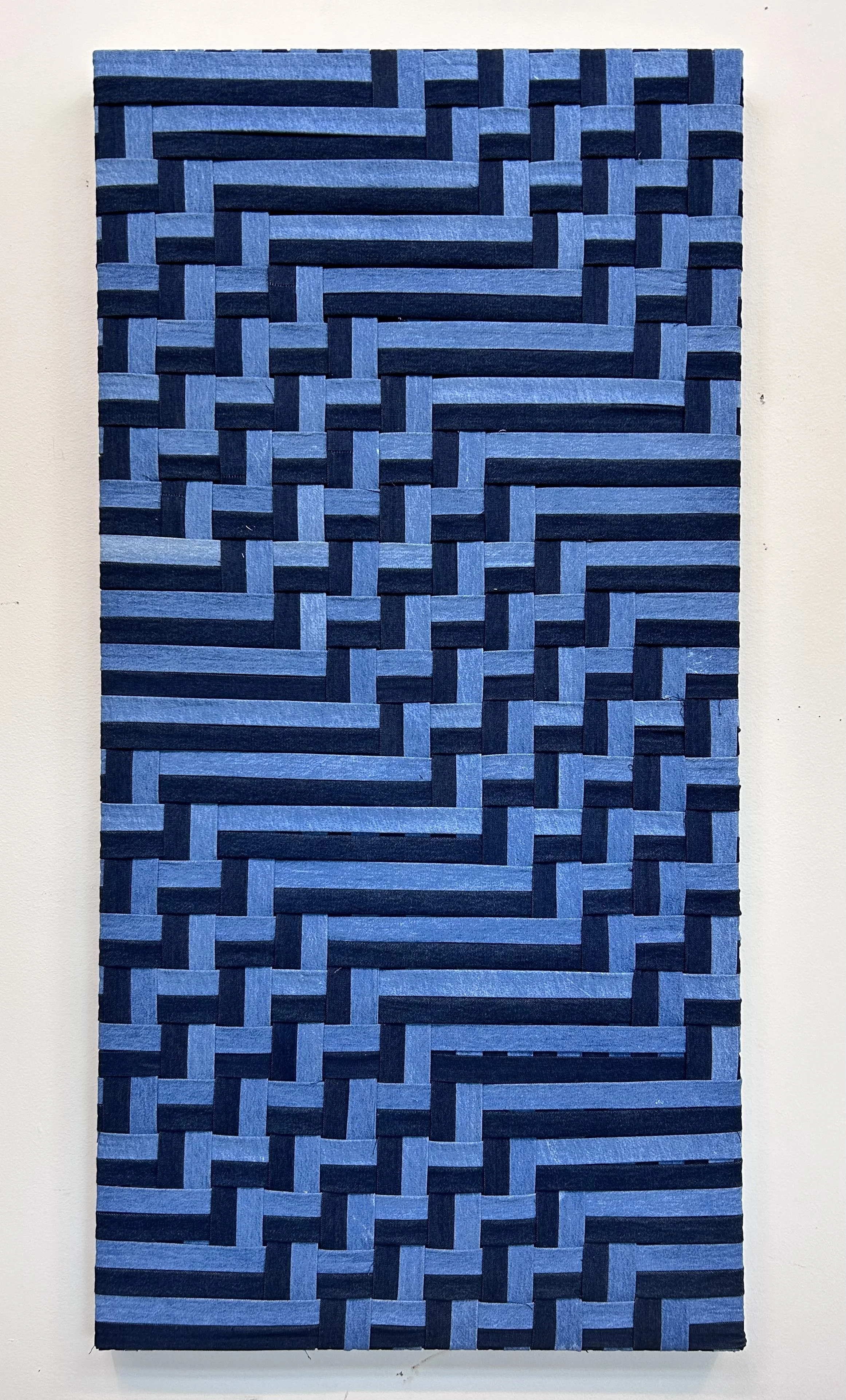 Waterway.

Binding tapes from used denim trousers on pine frame.

24  in x 48 in; 2024.