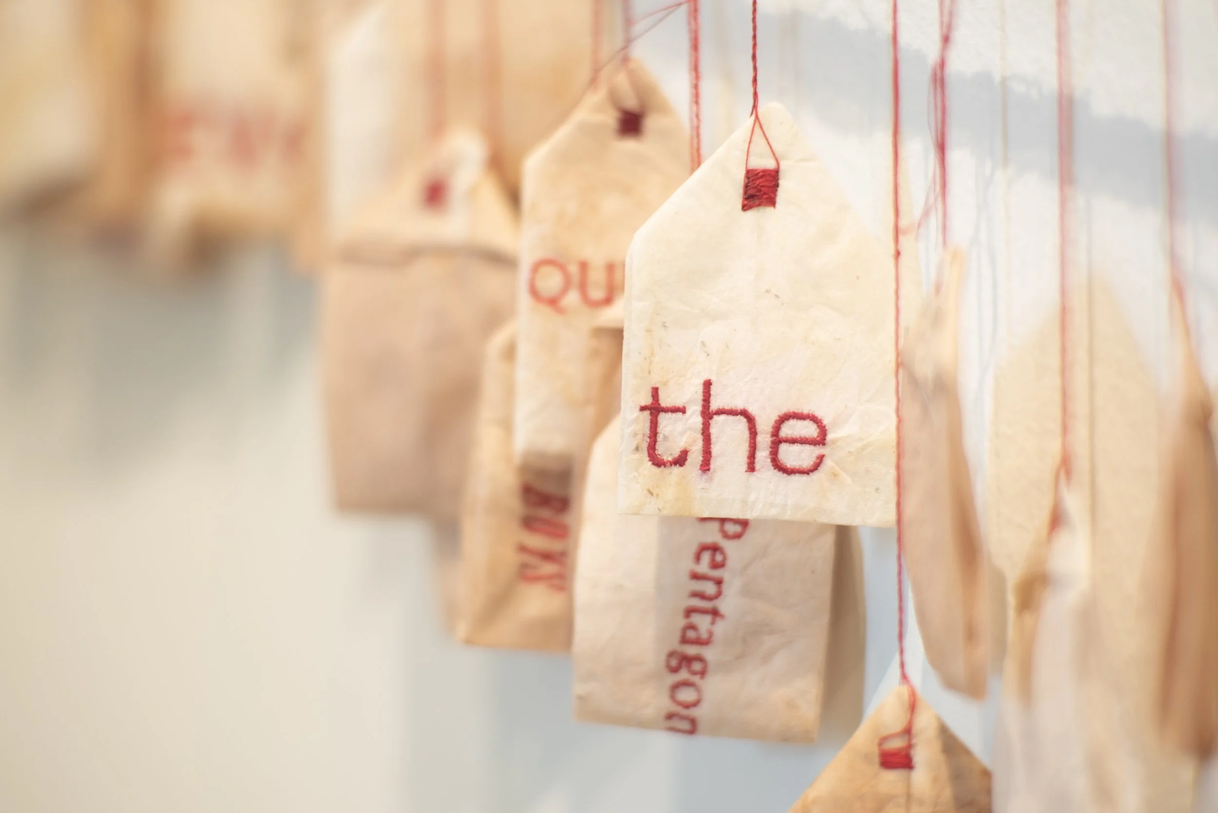 Detail: Breakfast of champions. Tea bags, rope, cotton thread. 6 ft x 30 ft x 1 in; 2024.
