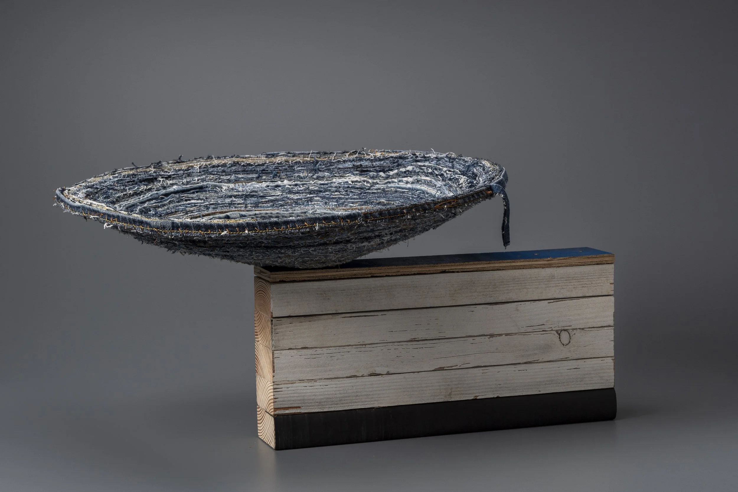 Origins of my universe.
Hand-stitched denim bowl on pine, rubber and plywood.
20 x 14 x 27 in; 2021.
