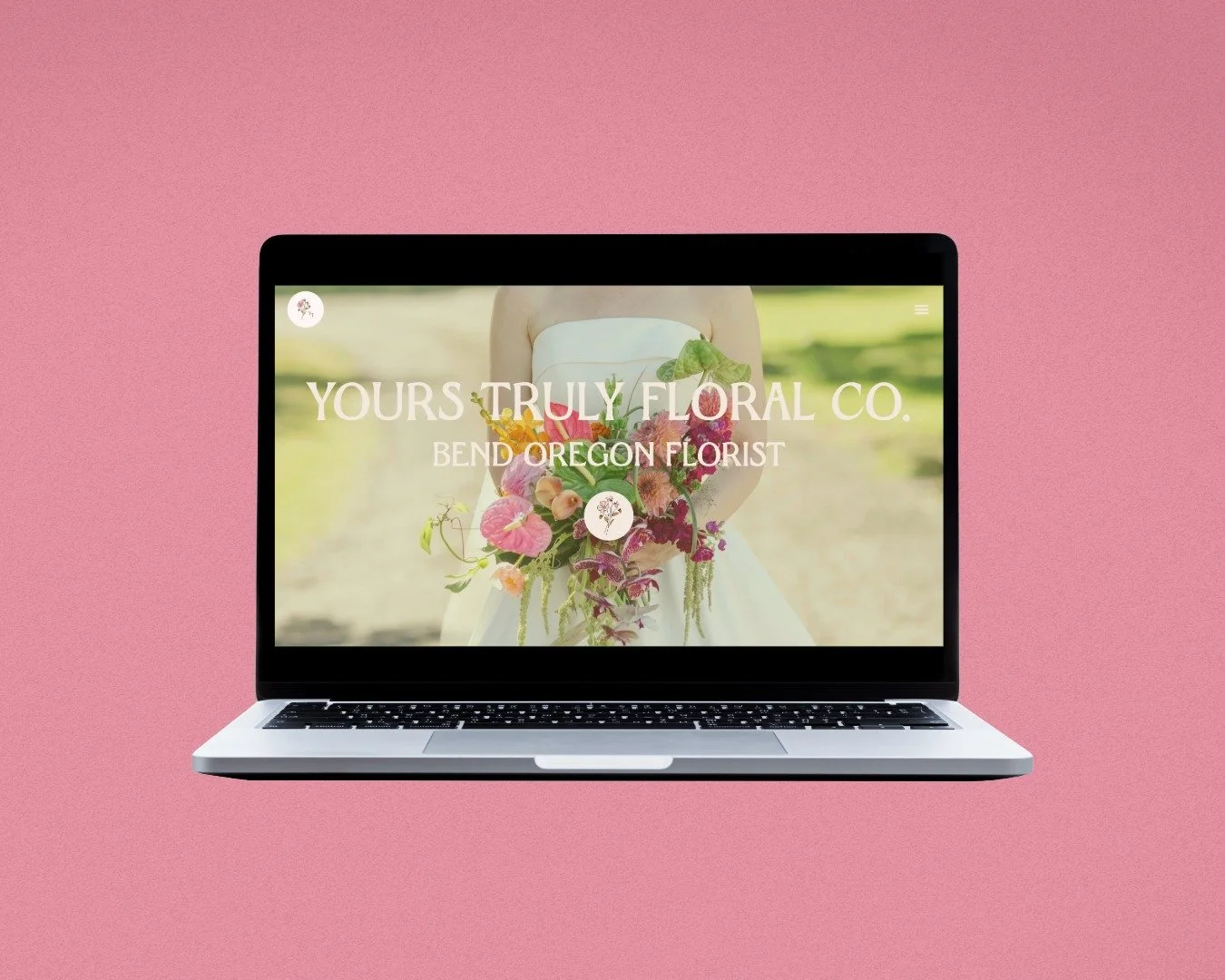 Laptop screen on a pink background with a homepage design for a wedding florist created by the best web designer in Bend Oregon.