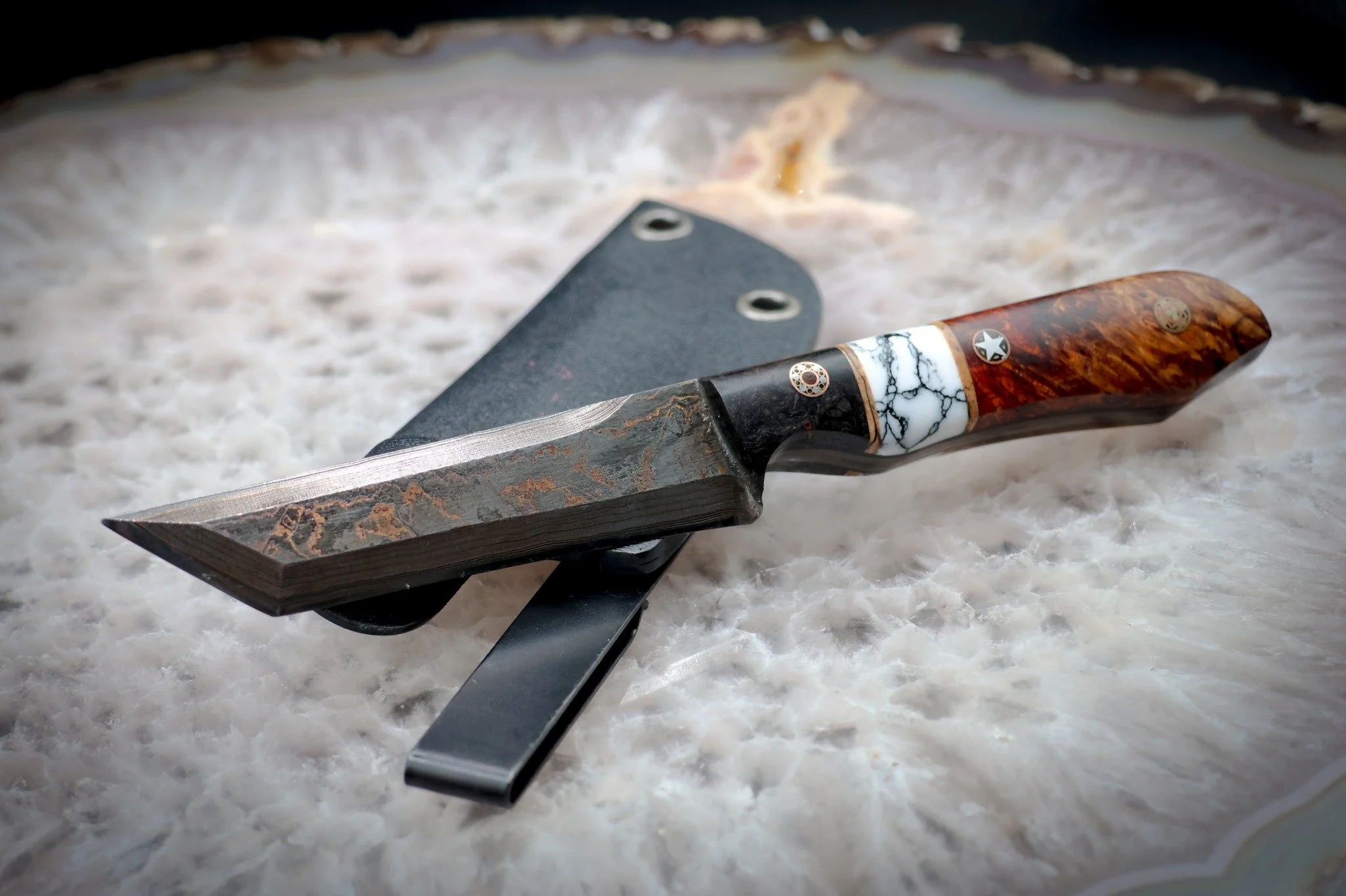 Tonto inspired tools are a fan favorite at our table. 

Check this 1080 and copper damascus forged by Iron Beak Forge. The handle is made from Black Ash, TruStone, Amboyna Burl and Blonde Spalted Maple.

This beauty and many others are now available 