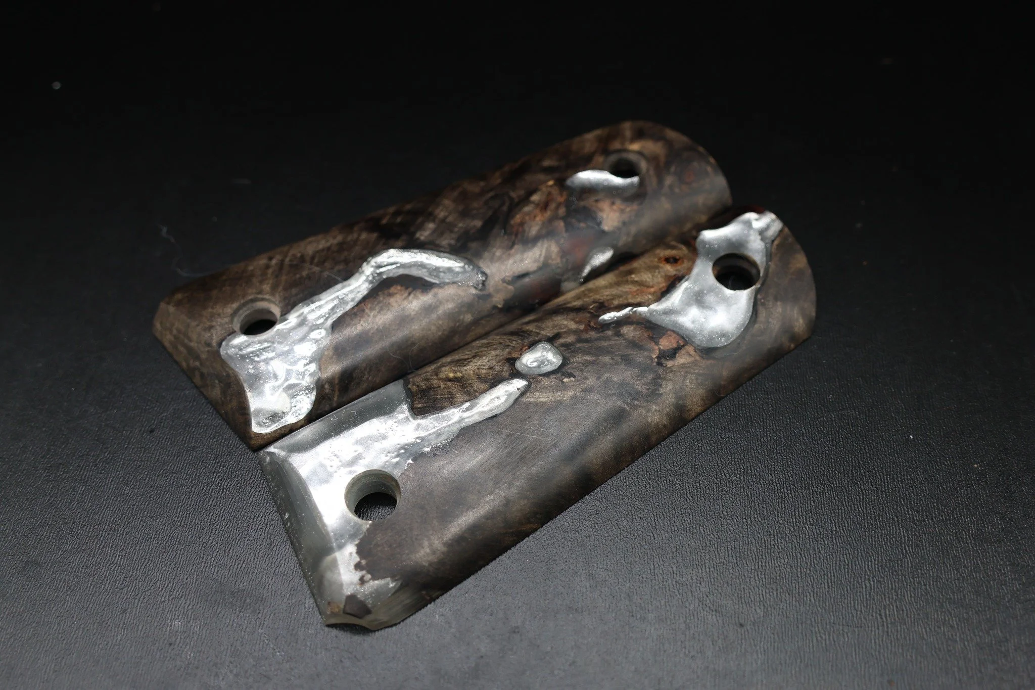 Hide the voids or make them the star? 👀

This compact set started with Buckeye full of natural voids and imperfections. Instead of cutting them away, we filled them with resin and added a metallic sheen that catches the light against the darker wood