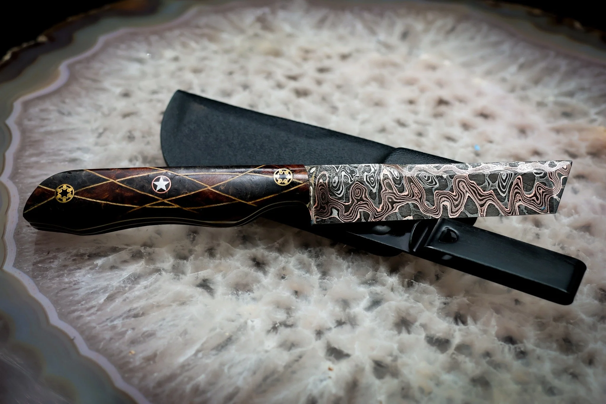 One of only FOUR. And there will never be another run.

This is Adam Deville's Double Dragon steel, forged from a billet that produced only four blades. Once they're gone, they're gone. This pattern won't be duplicated.

For the handle, we built a ge