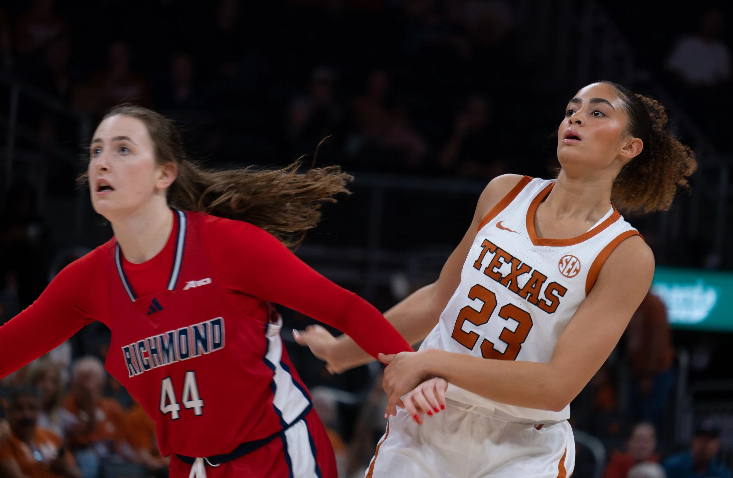 From right, freshman Aaliyah Crump holds Richmond senior Maggie Doogan in the game on Friday, Nov. 7 at Moody Center. The Longhorns defeated the Spiders 85-56.