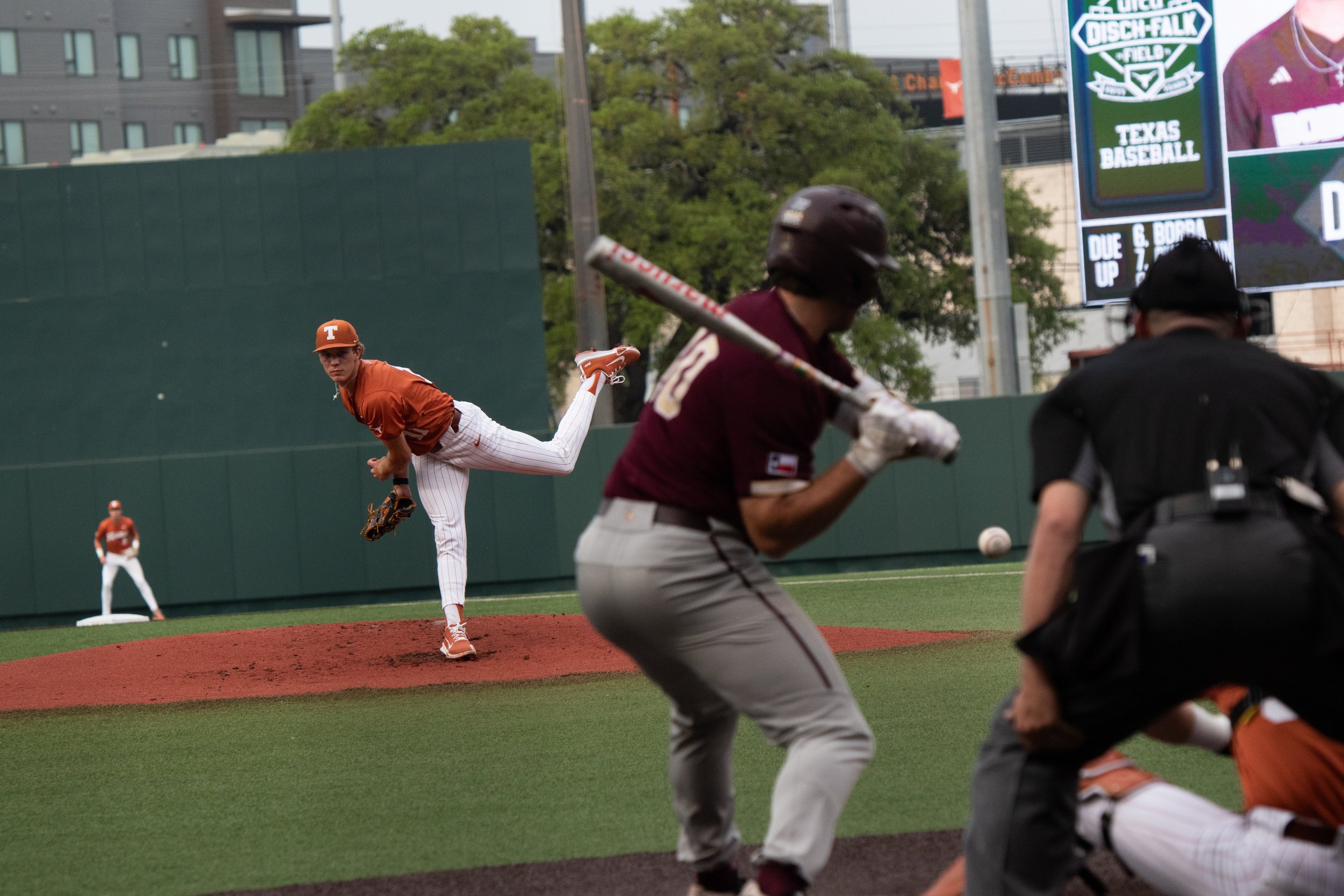 Number 11, Kade Bing pitches baseball to Austin Eaton that is caught by the catcher at the Texas vs. Texas State game on April 1, 2025.