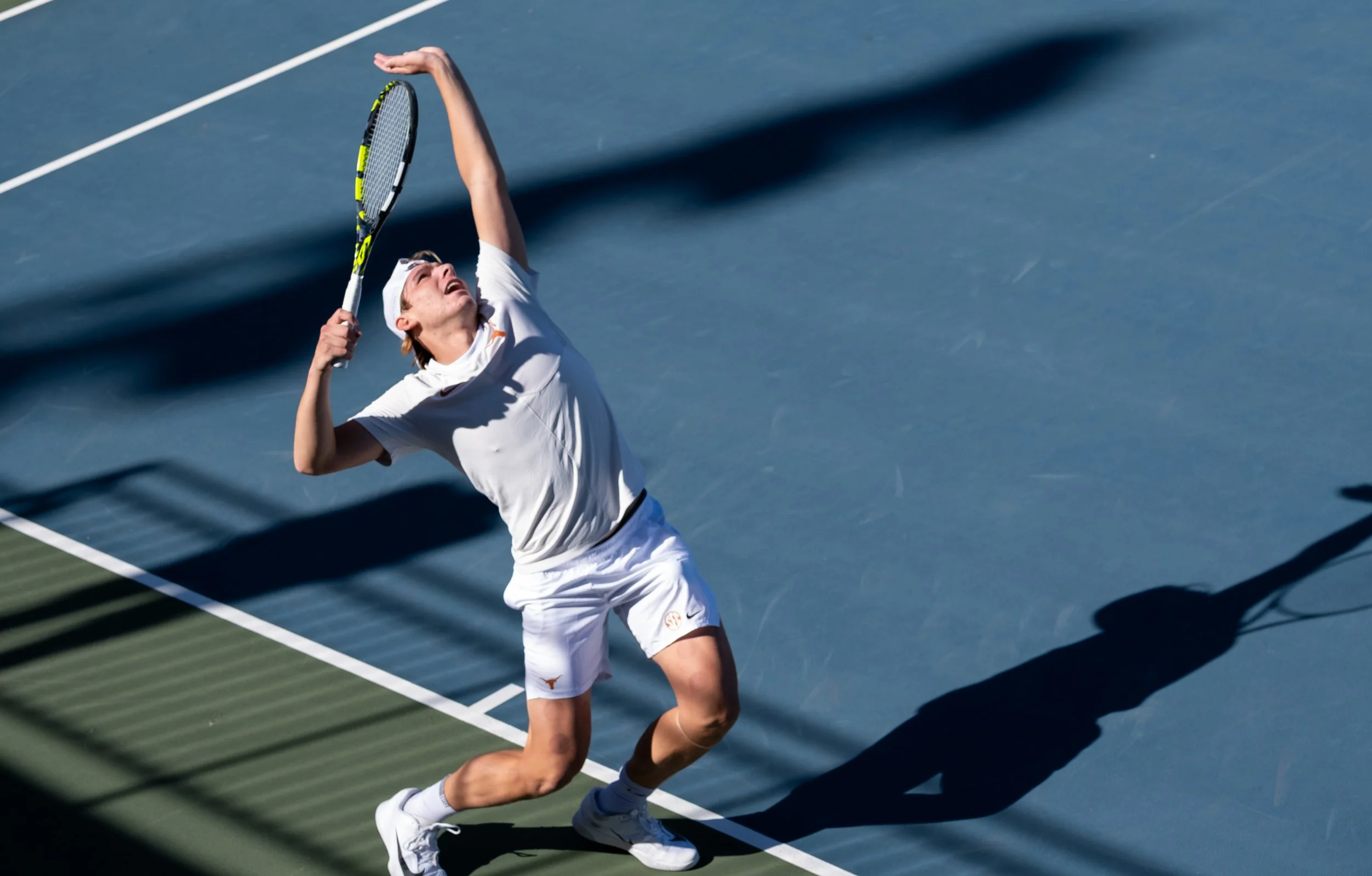 Freshman Mariano Dedura-Palomero serves at a singles match against Virginia on Sunday, Jan. 18.