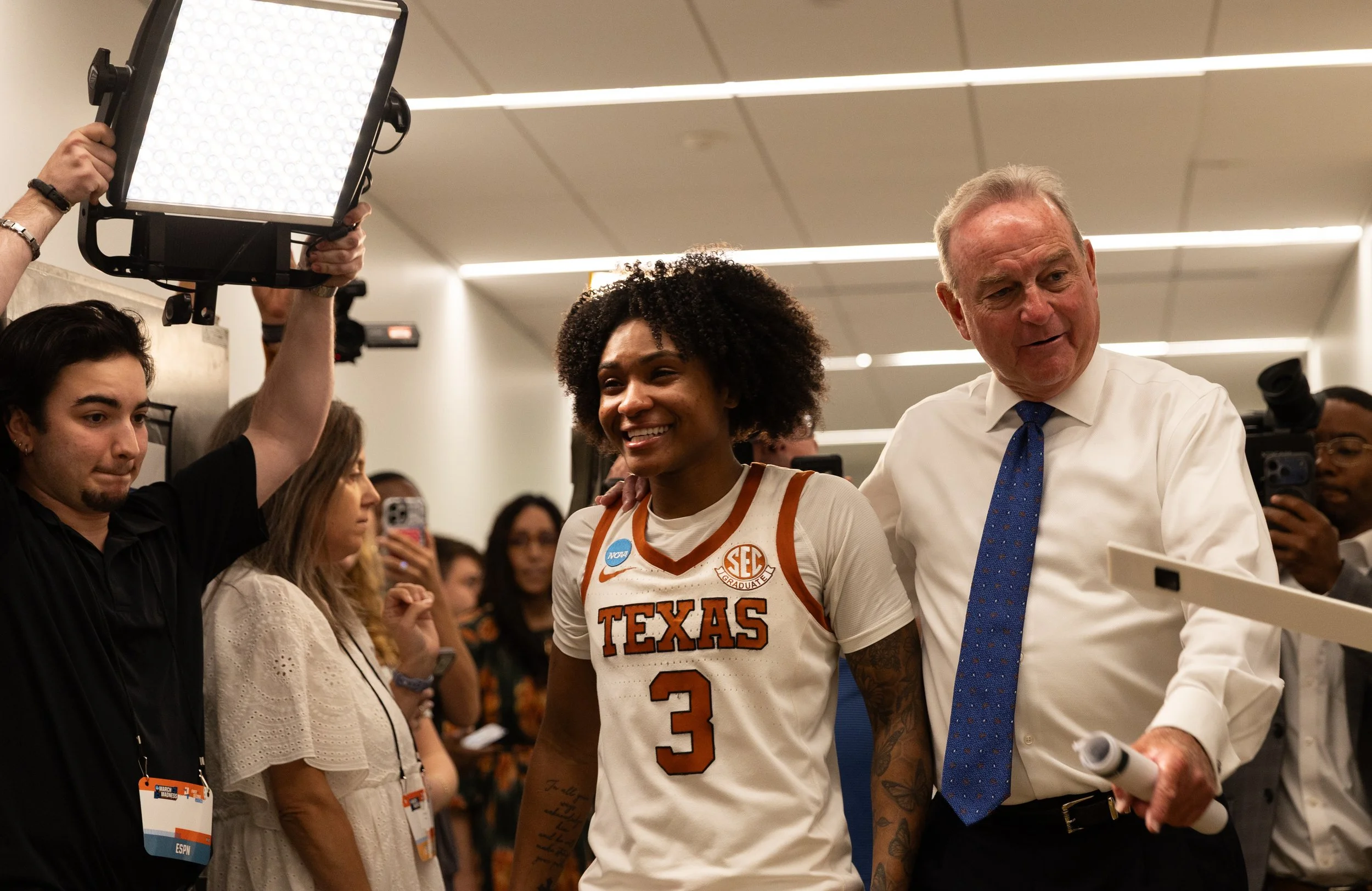 Texas coach Vic Schaefer walks with Texas senior guard Rori Harmon toward the locker rooms after Texas' win against Oregon at Moody Center on March 22, 2026. This game was Rori Harmon's last time playing at Moody Center