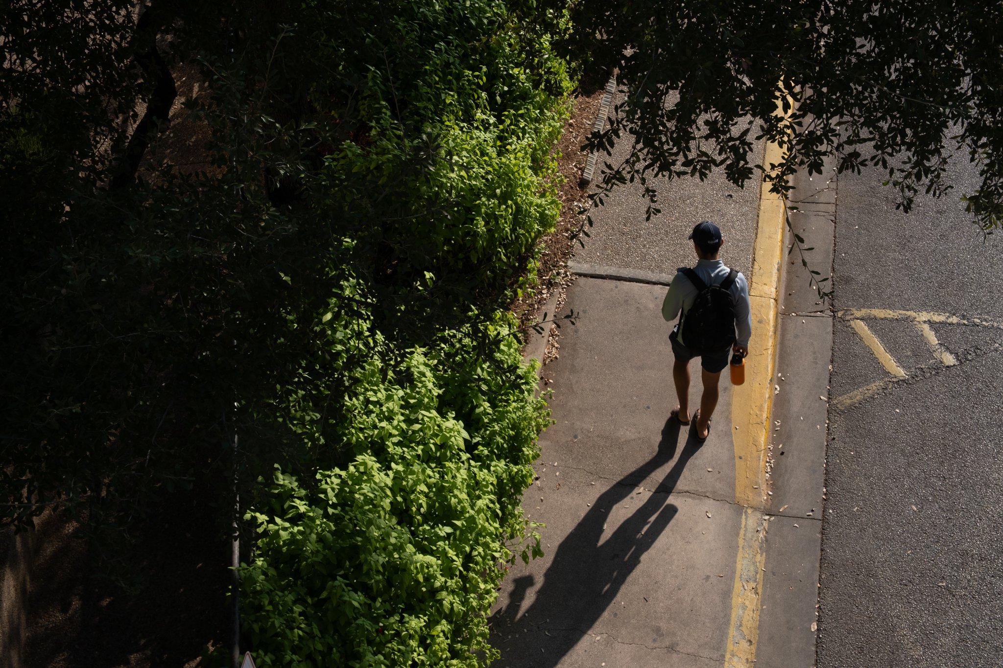 Student walks by McCombs School of Business on Oct.9, 2025.