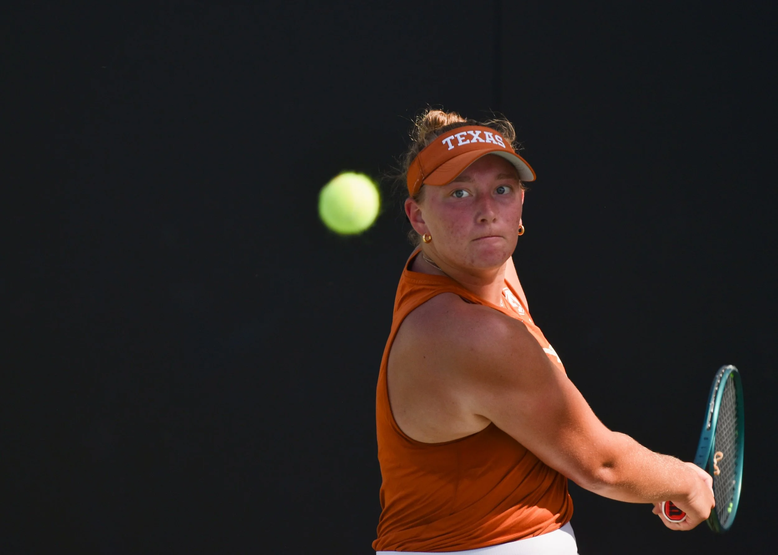 Ashton Bowers looks at tennis ball during her match against Mell Reasco at the Georgia vs. Texas game on April 11, 2025.